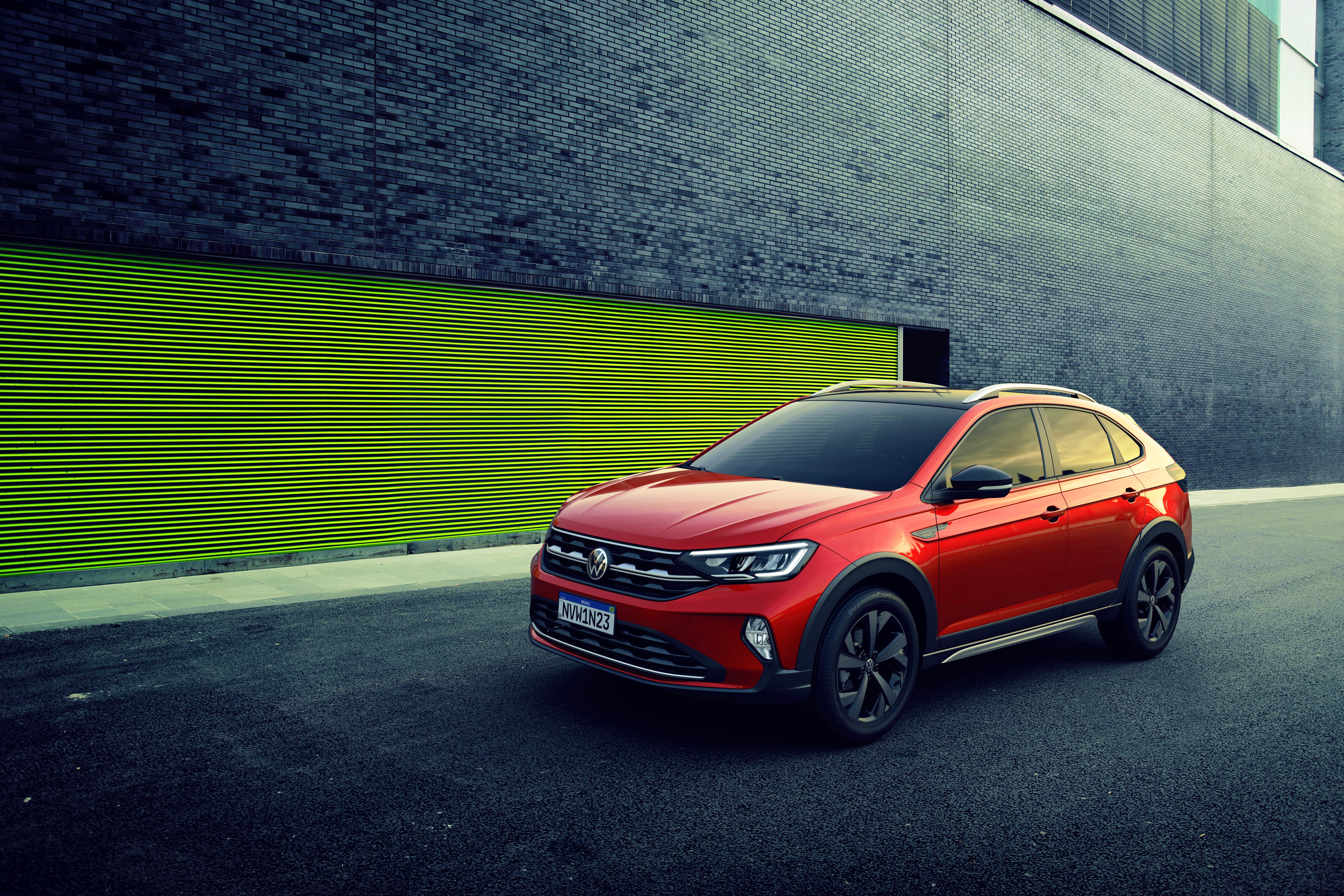 Red Volkswagen Nivus 200 TSI Latam parked HD Wallpaper