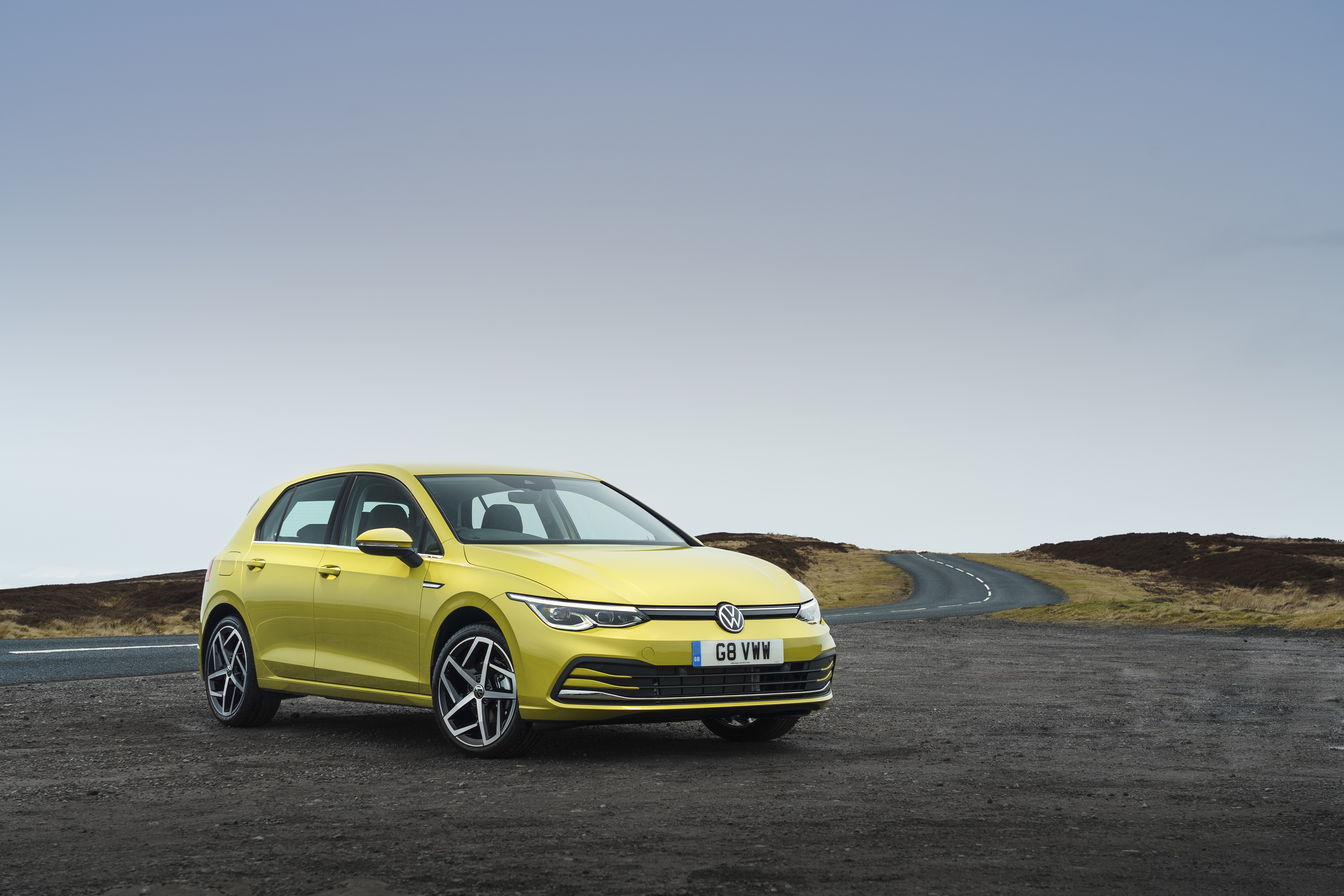 Yellow Volkswagen Golf Style on a Road HD Wallpaper