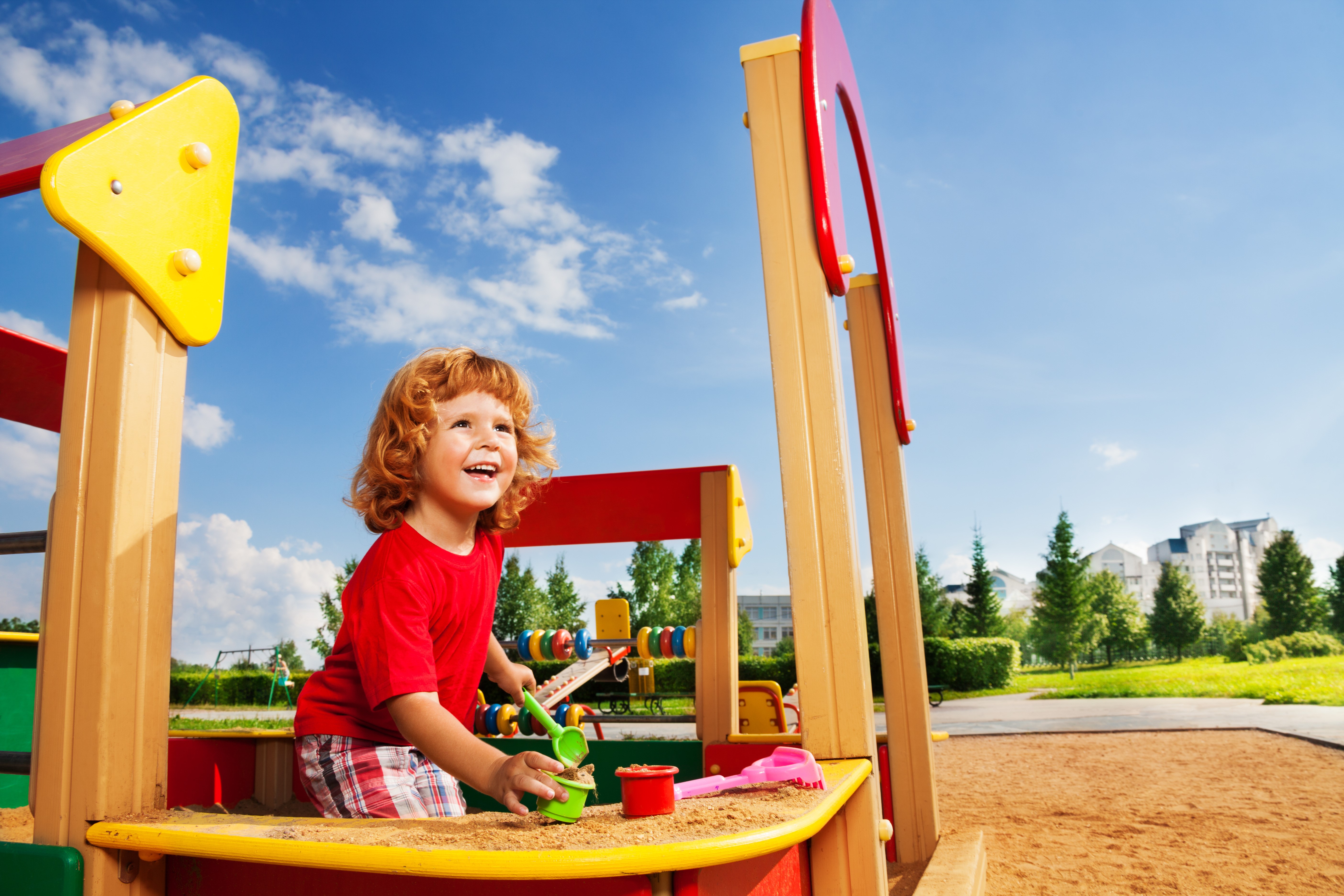 Boy playing in a sandbox HD Wallpaper