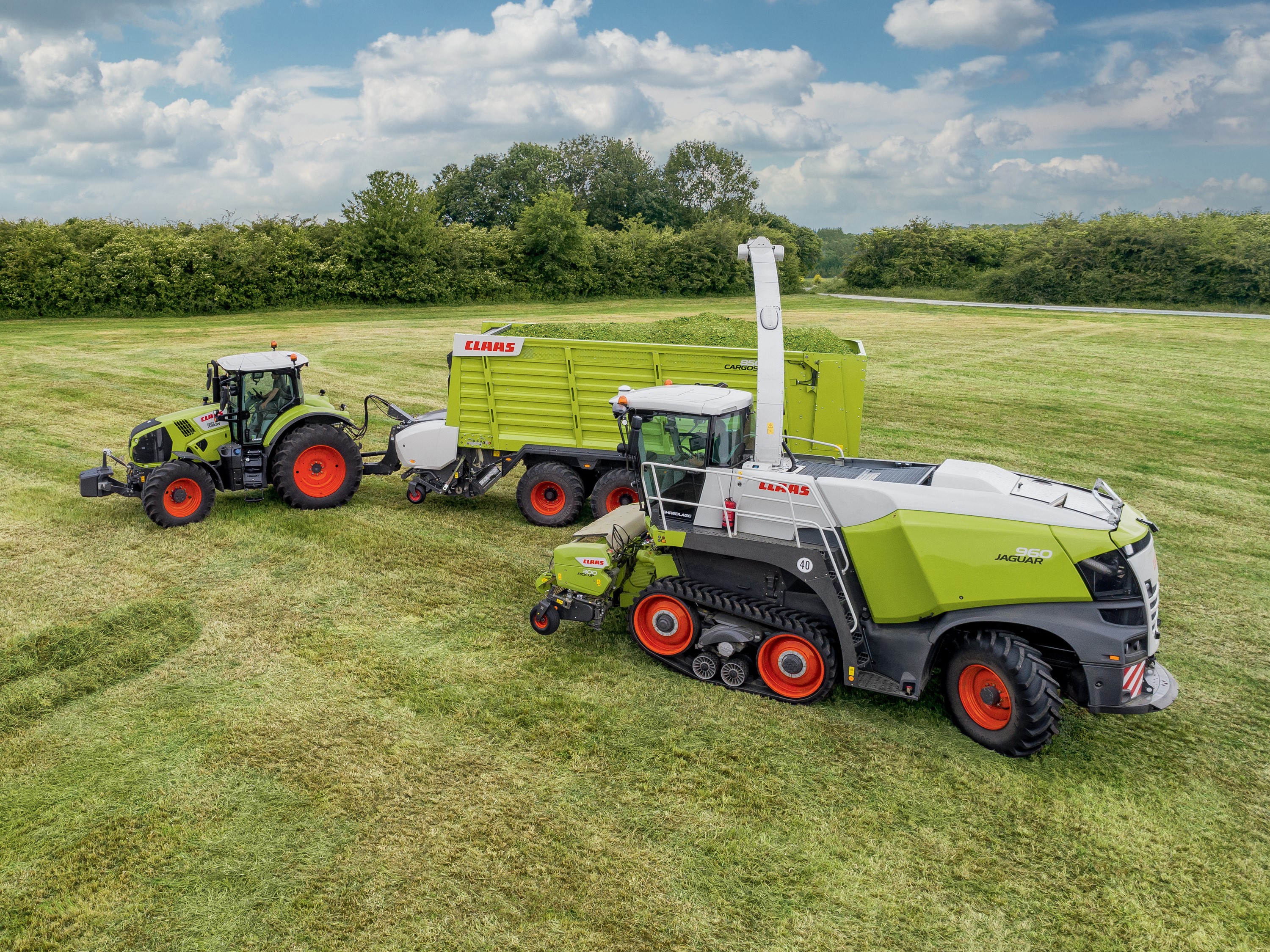 Claas Jaguar 960 Terra Trac and Tractor in a Field HD Wallpaper