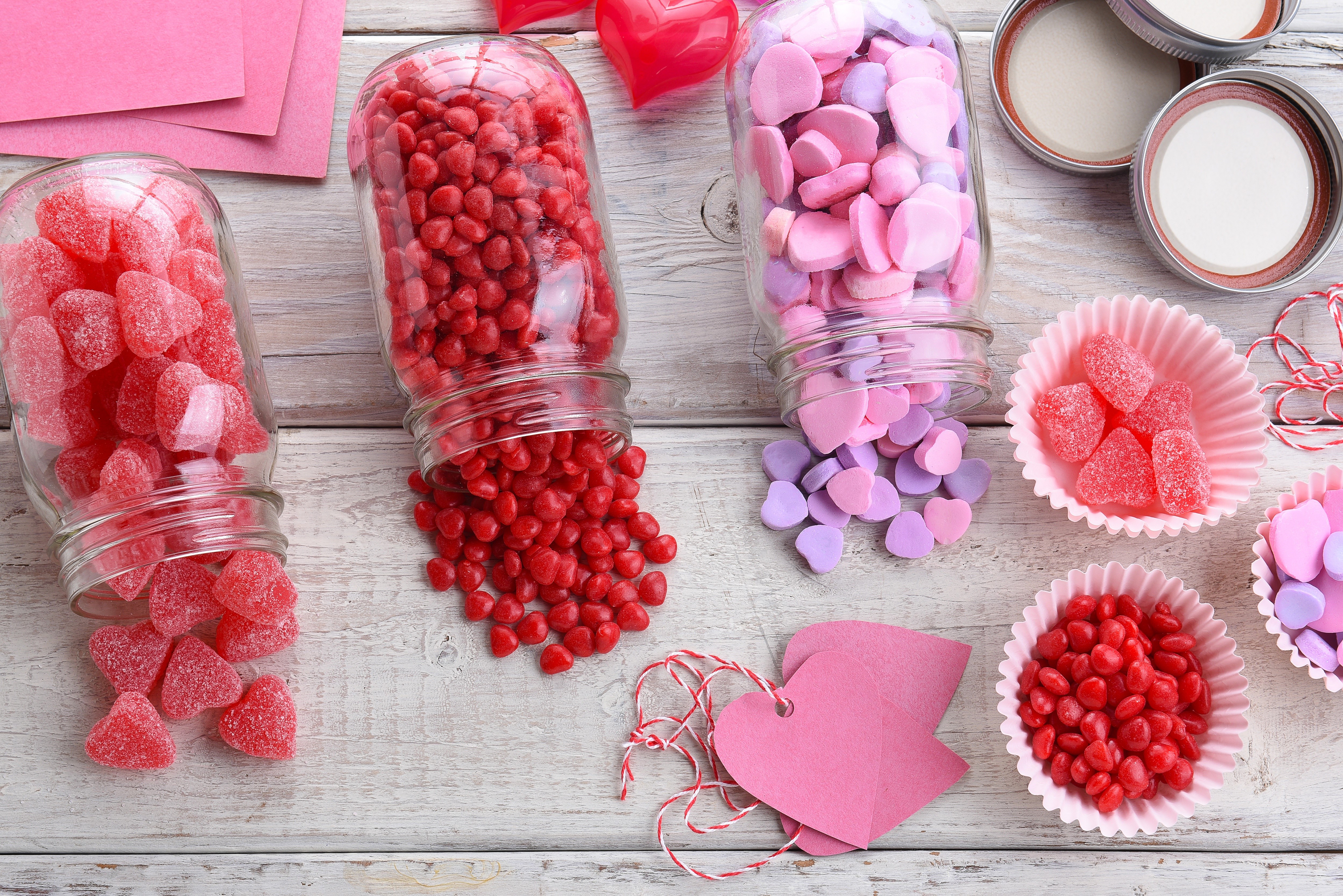 Valentine's Day candy in jars and cups HD Wallpaper