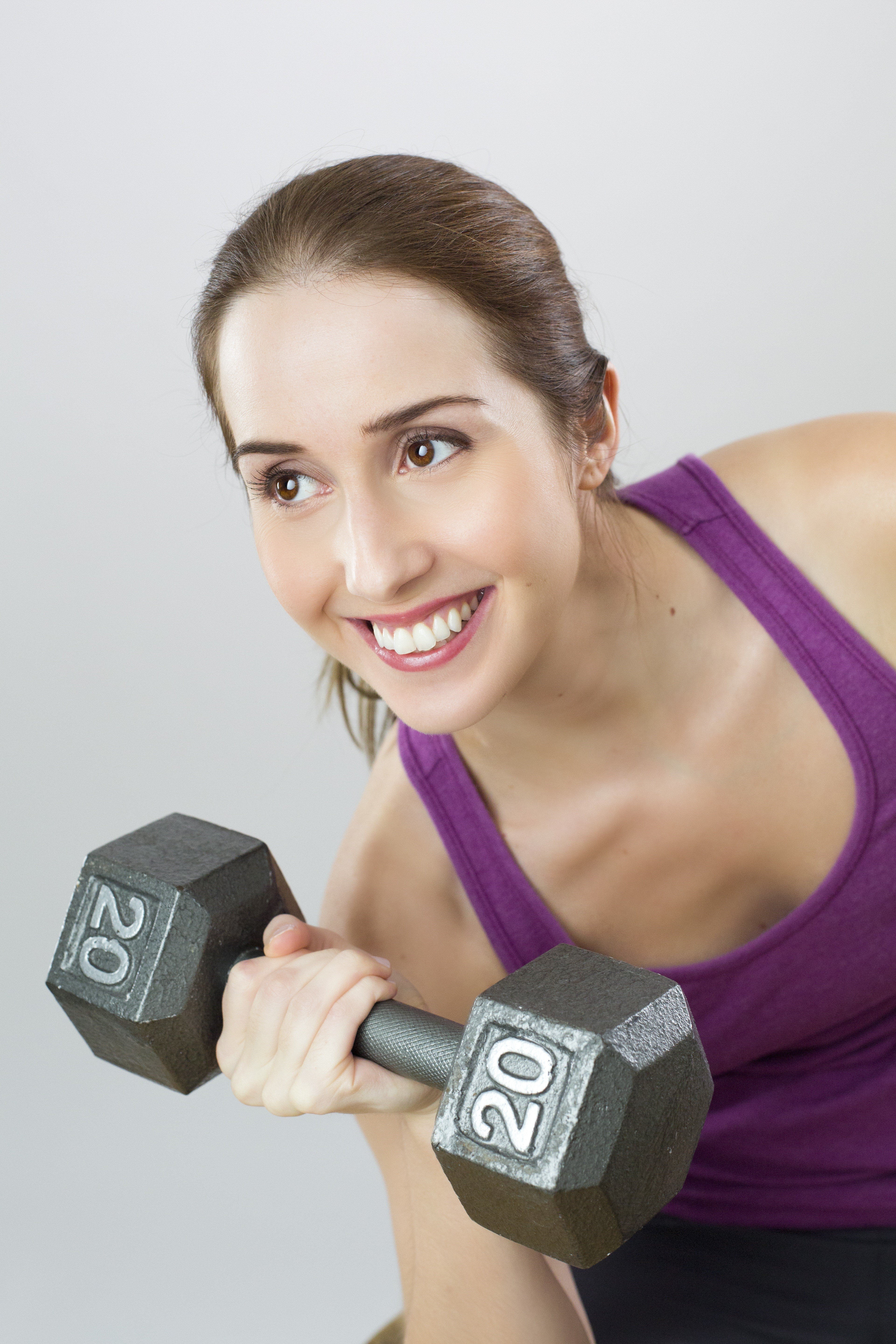 Woman lifting 20lb dumbbell HD Phone Wallpaper