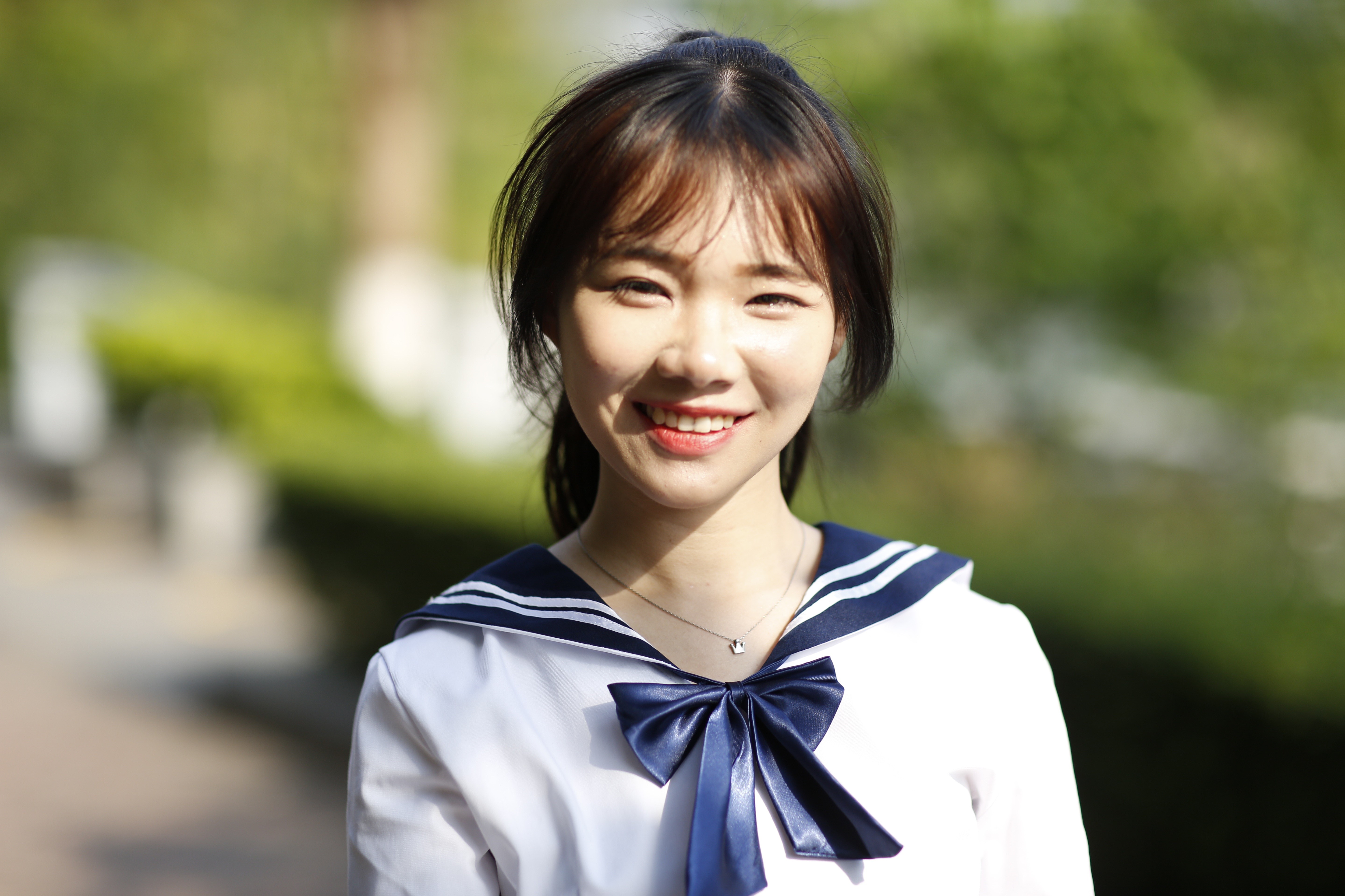 4K Portrait of Smiling Asian Schoolgirl HD Wallpaper