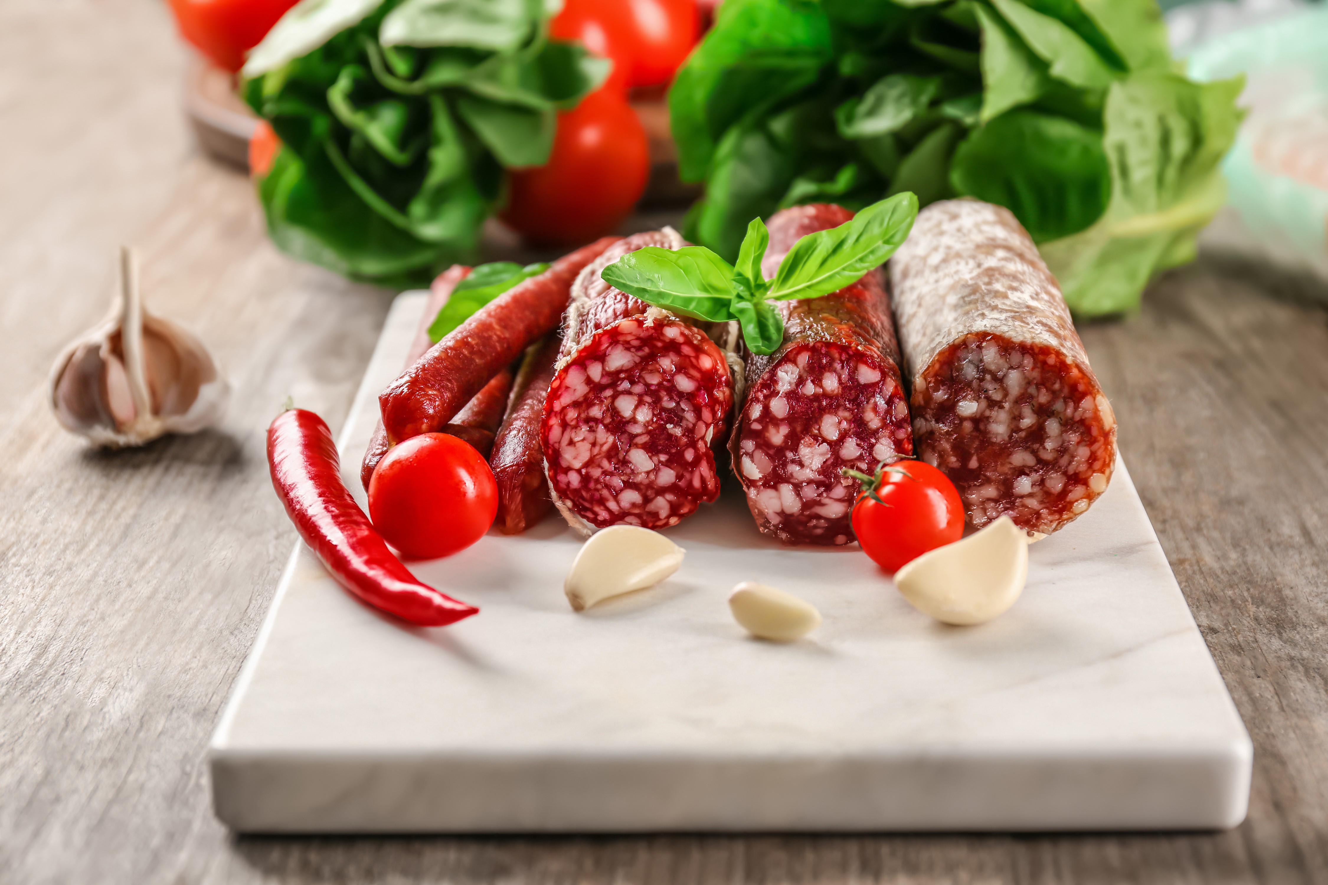 Sausage, Chili Pepper, Garlic, Tomatoes, and Basil on Cutting Board HD Wallpaper