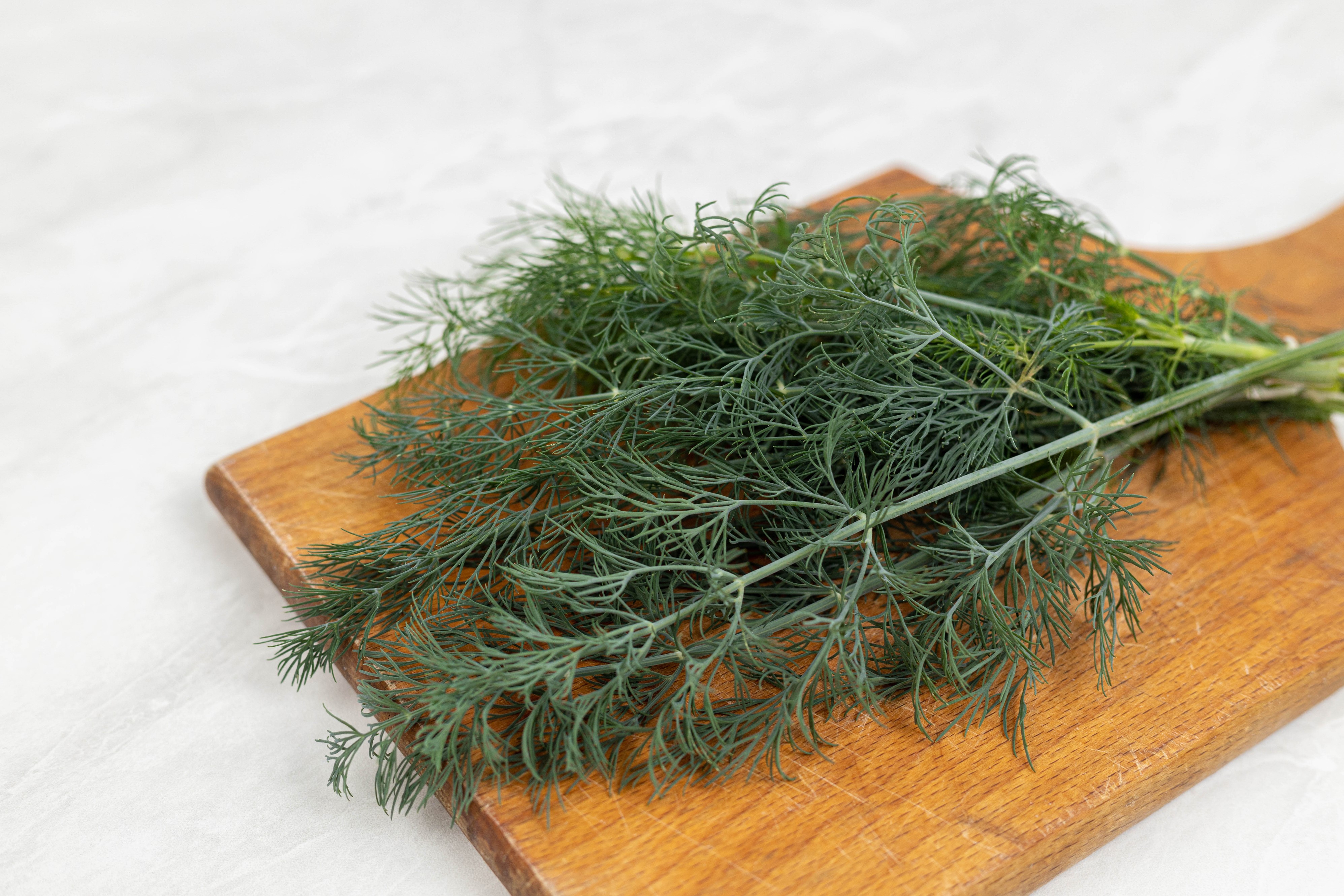 Dill on a cutting board HD Wallpaper