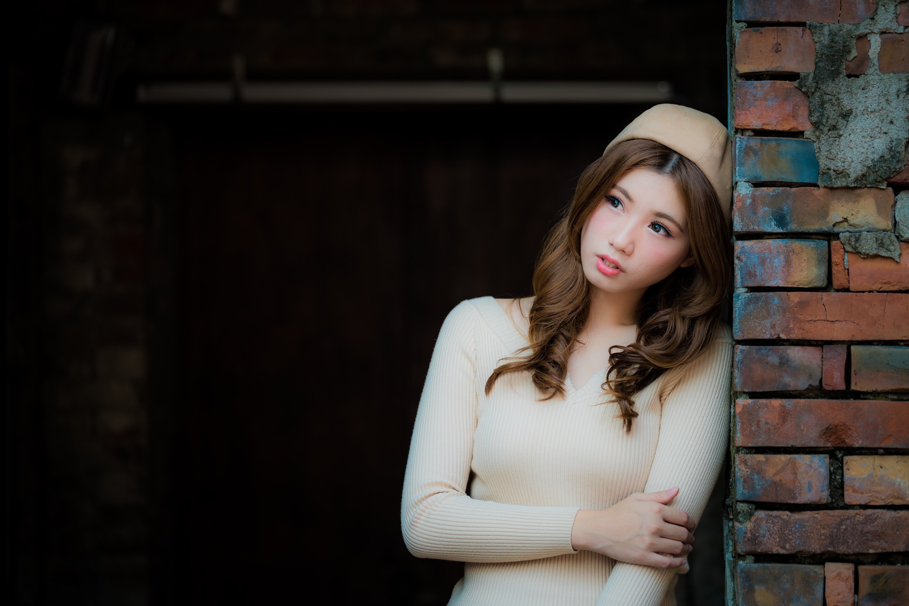 Asian woman with brown hair wearing a beige sweater and hat HD Wallpaper