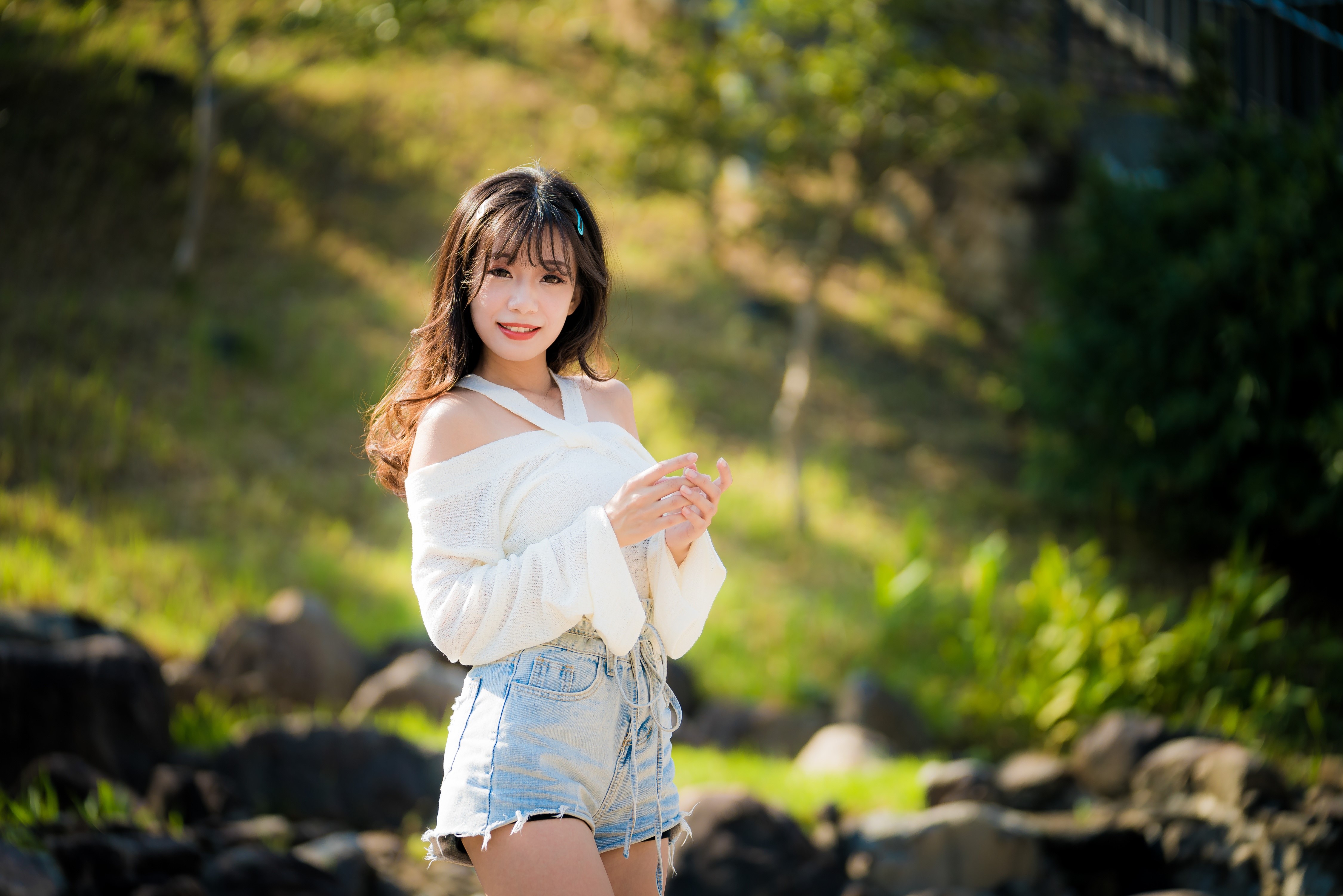 Asian woman with brown hair in shorts and white top HD Wallpaper