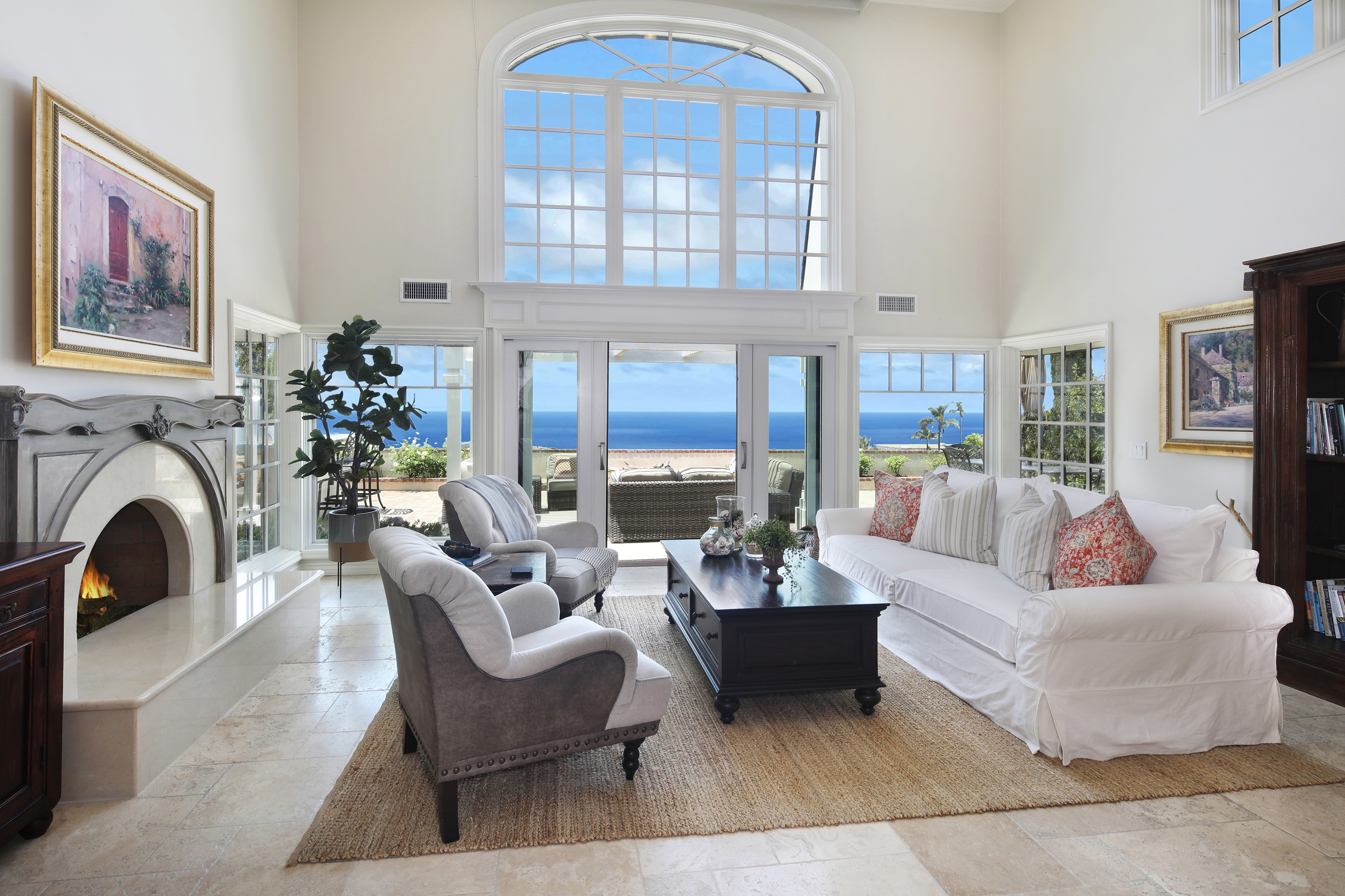 Living room with fireplace and ocean view HD Wallpaper