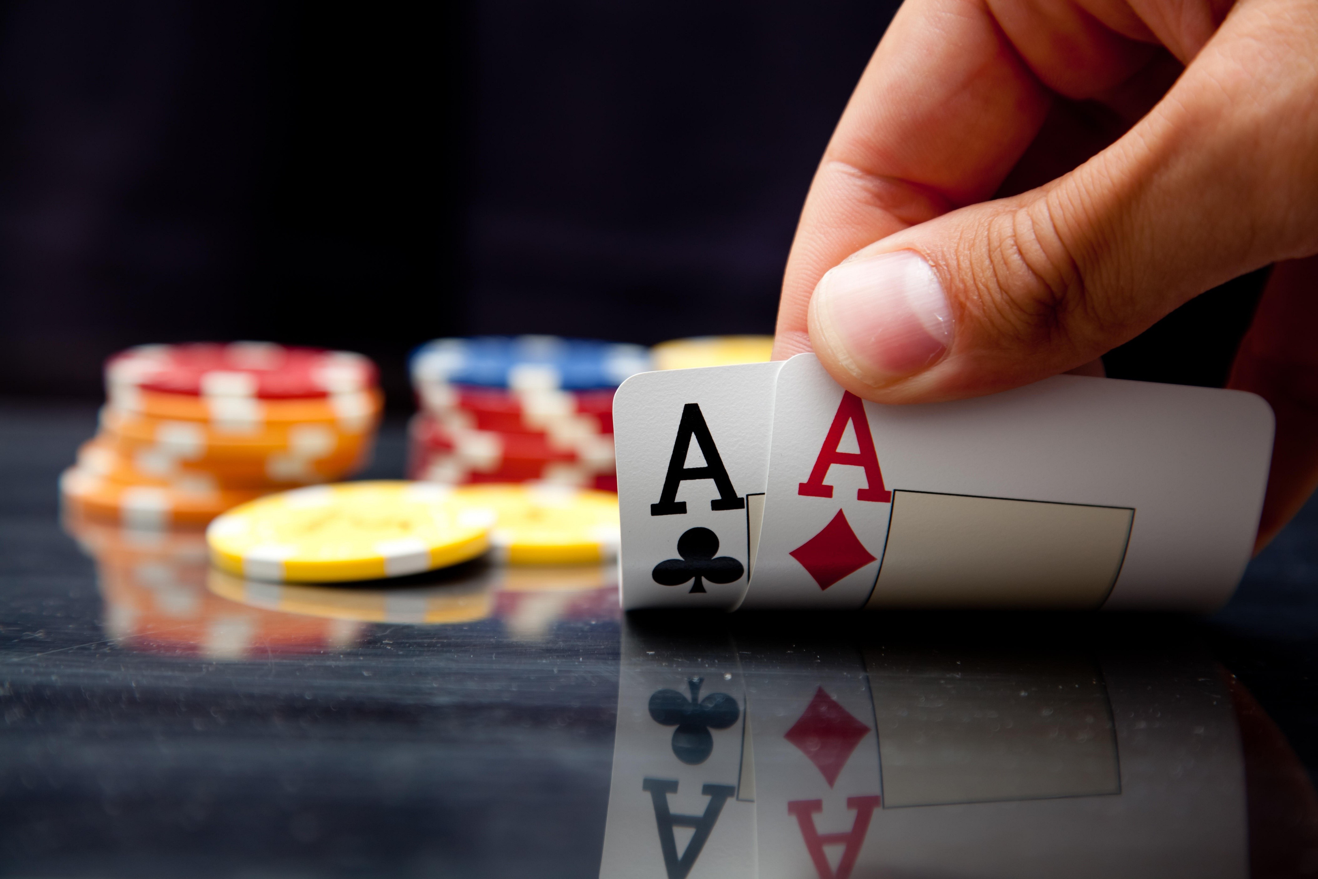 Two Aces in a Poker Game with Casino Tokens HD Wallpaper