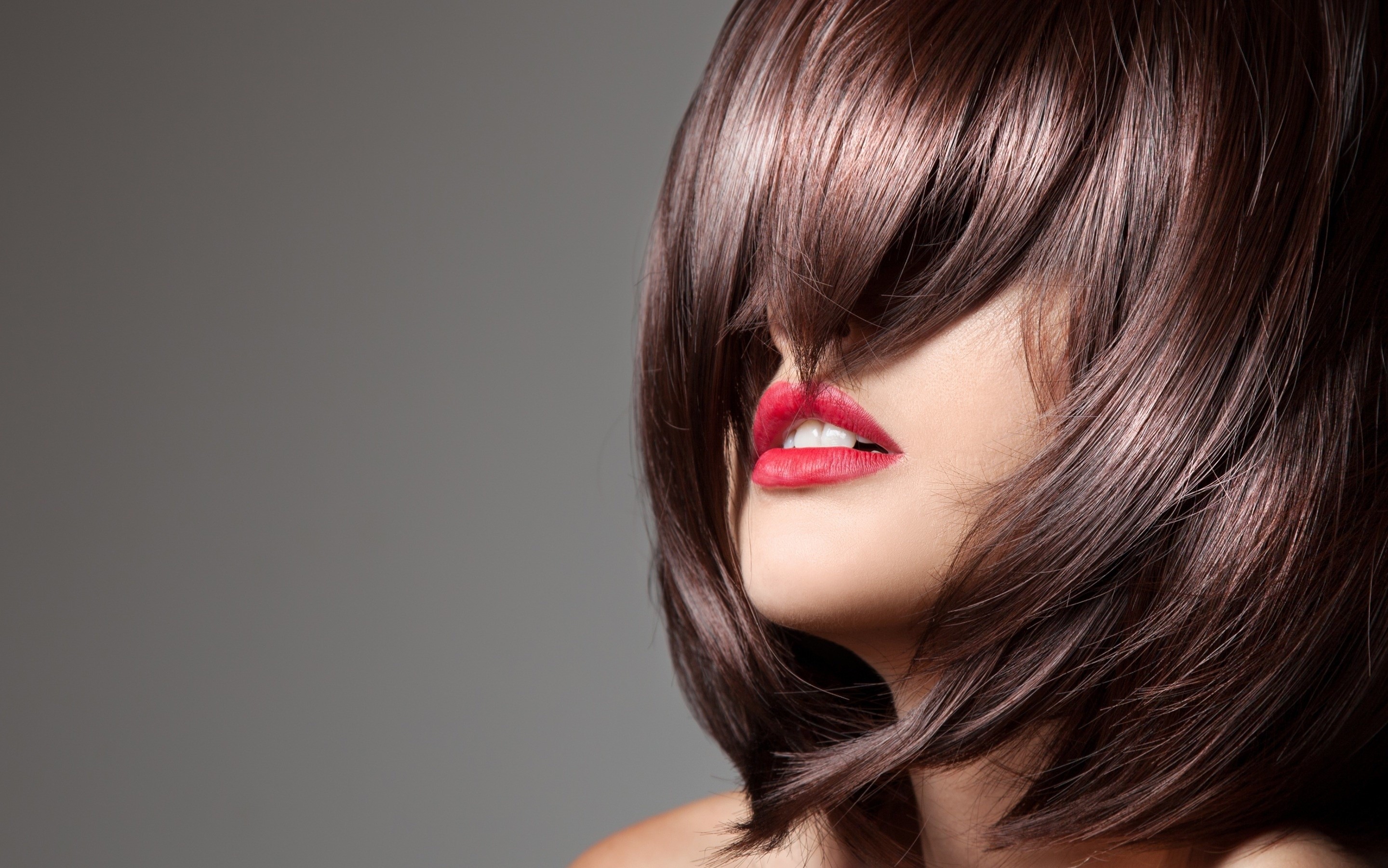 Woman with brown hair and red lips HD Wallpaper