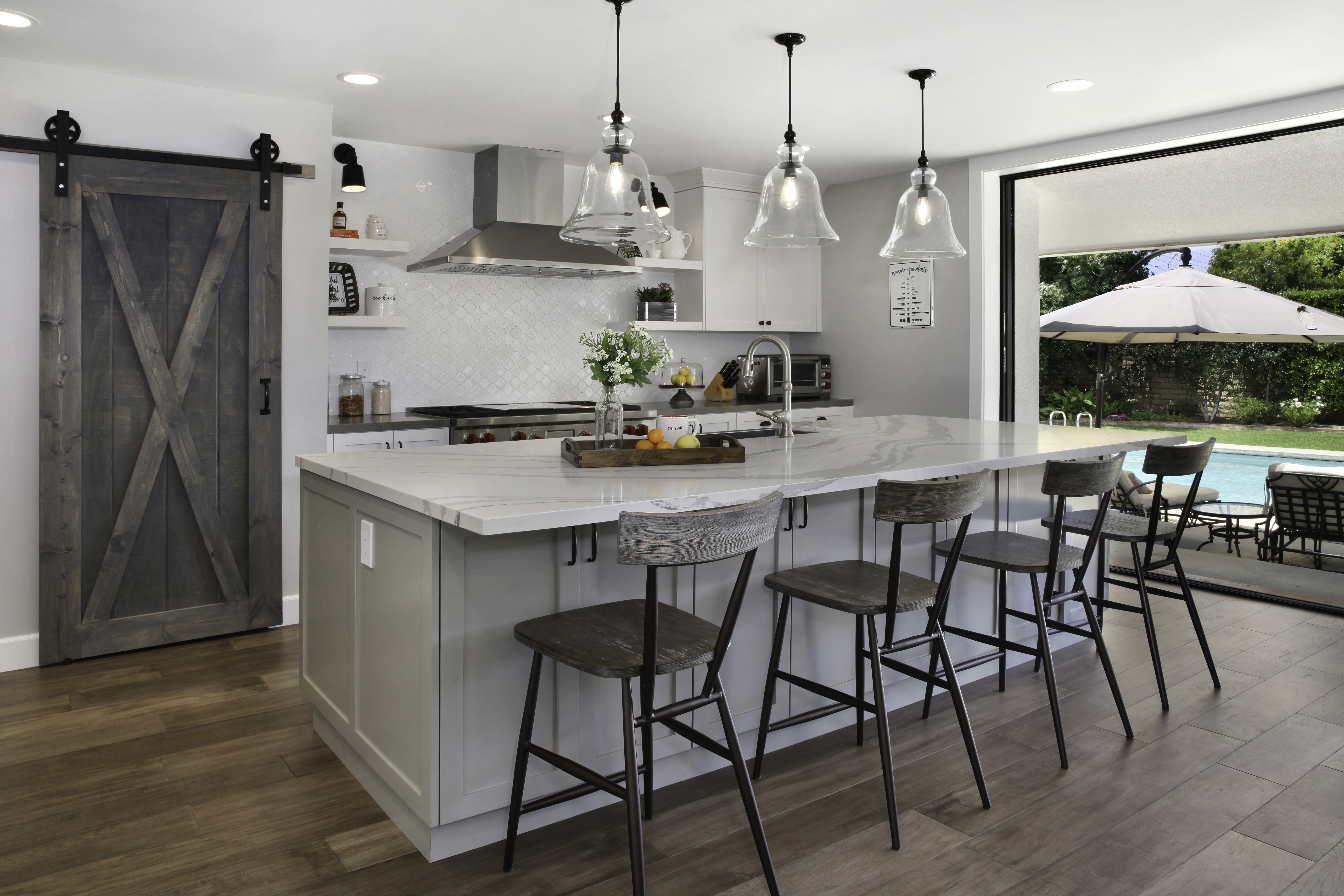 Modern Kitchen with Island and Outdoor Pool View HD Wallpaper