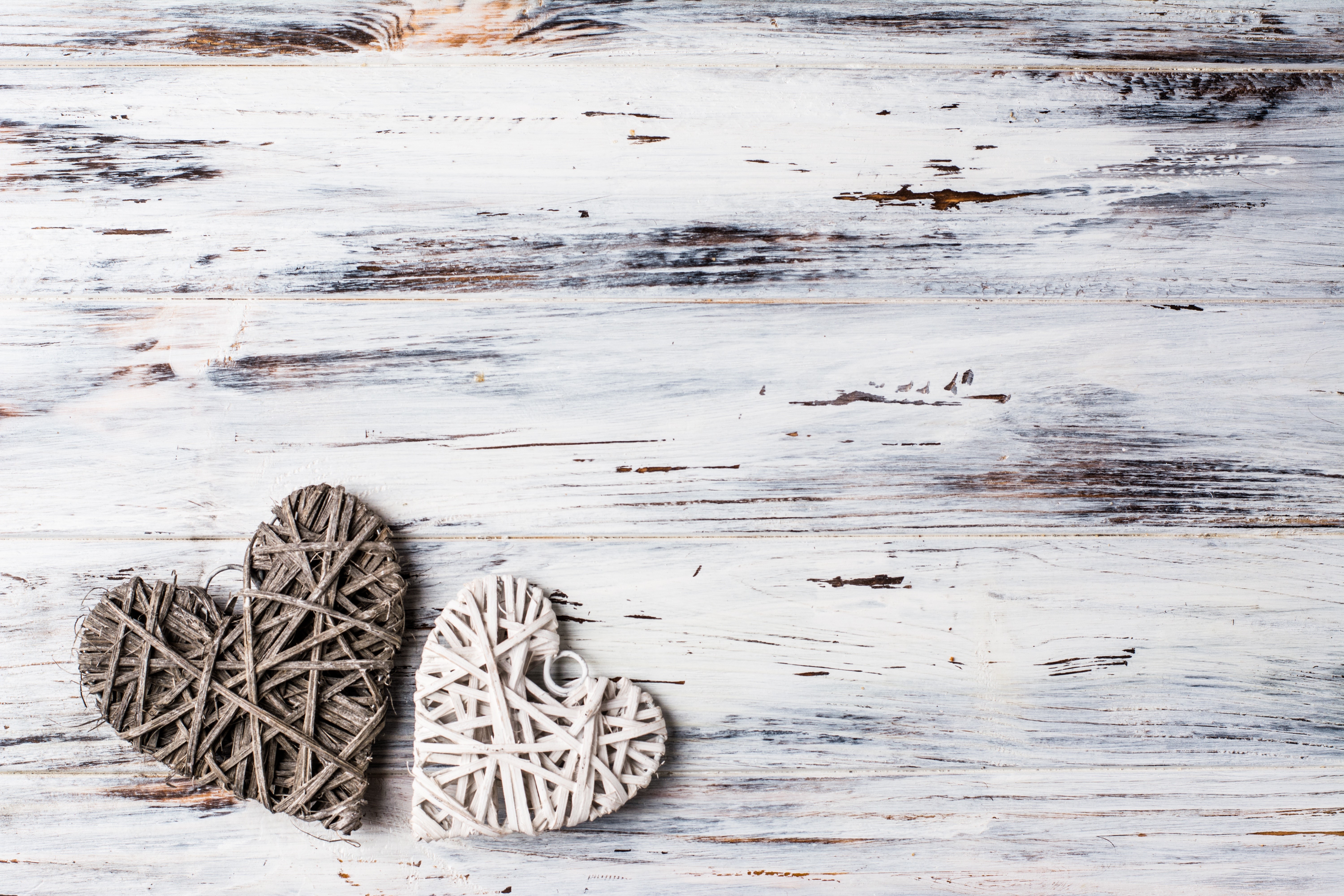 Two Woven Hearts on White Wood Background HD Wallpaper