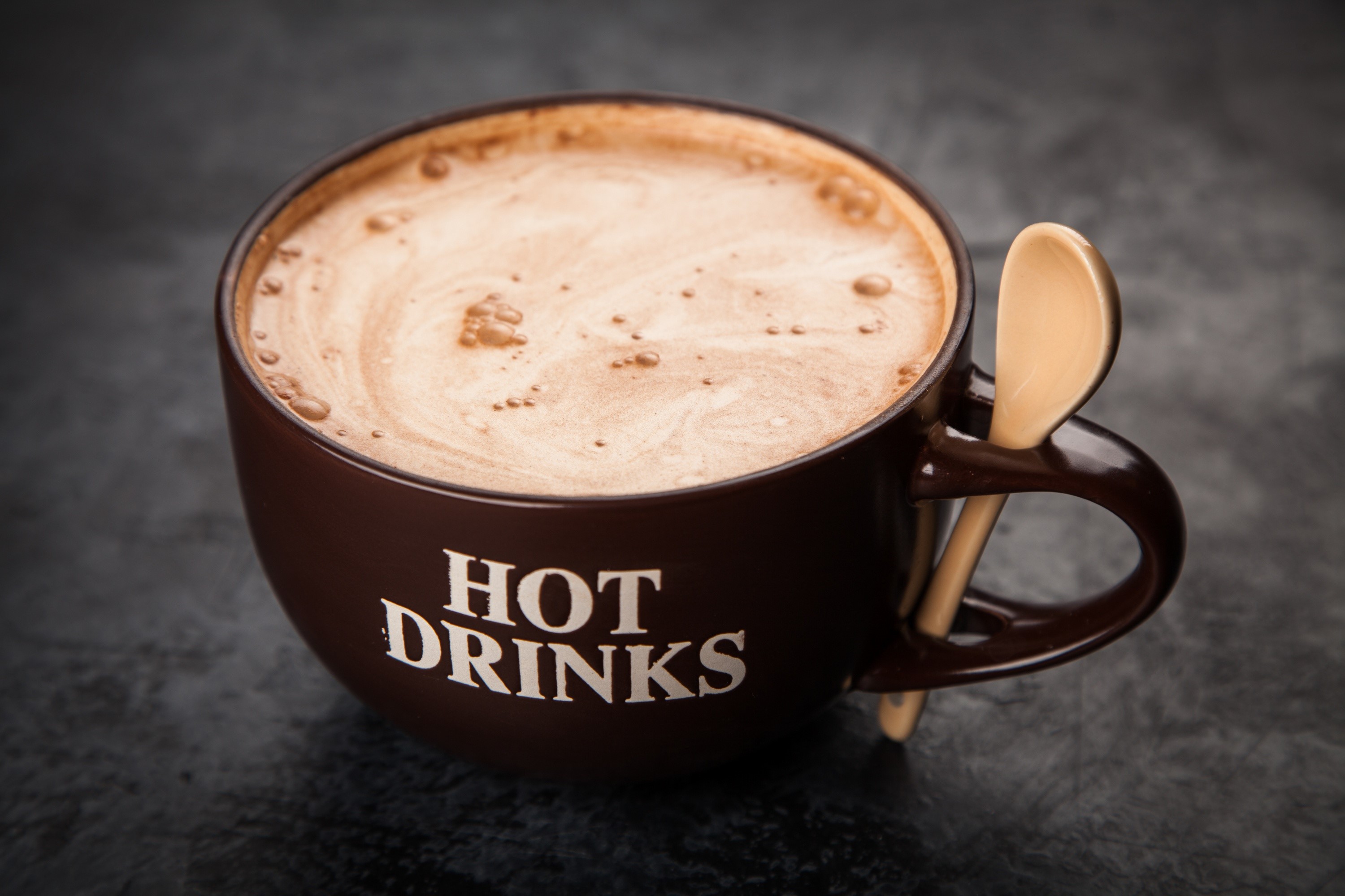 Brown mug with hot drinks and spoon HD Wallpaper