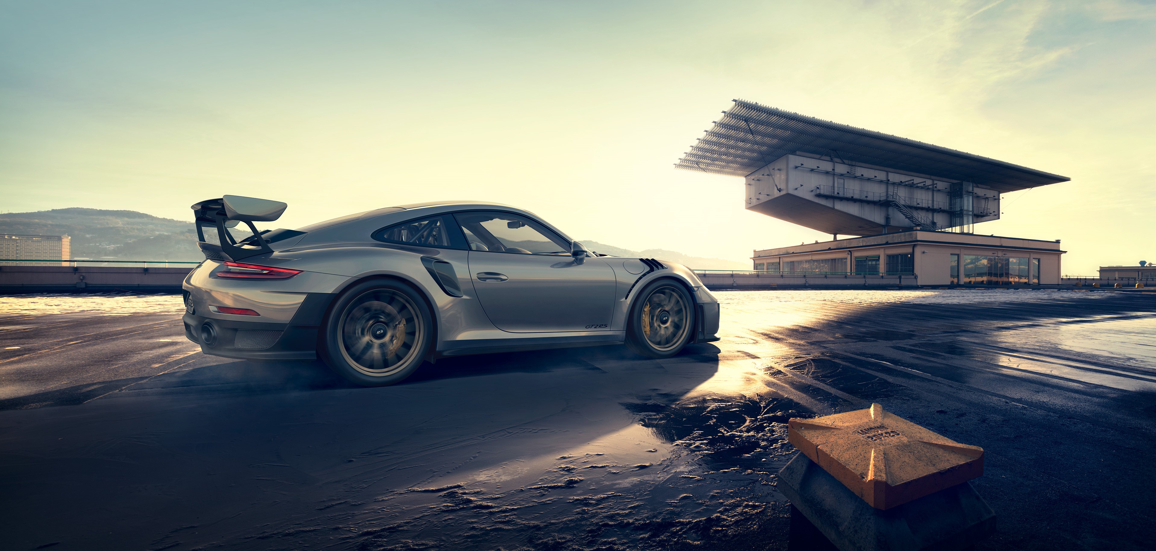 Silver Porsche 911 GT2 RS on a rooftop HD Wallpaper
