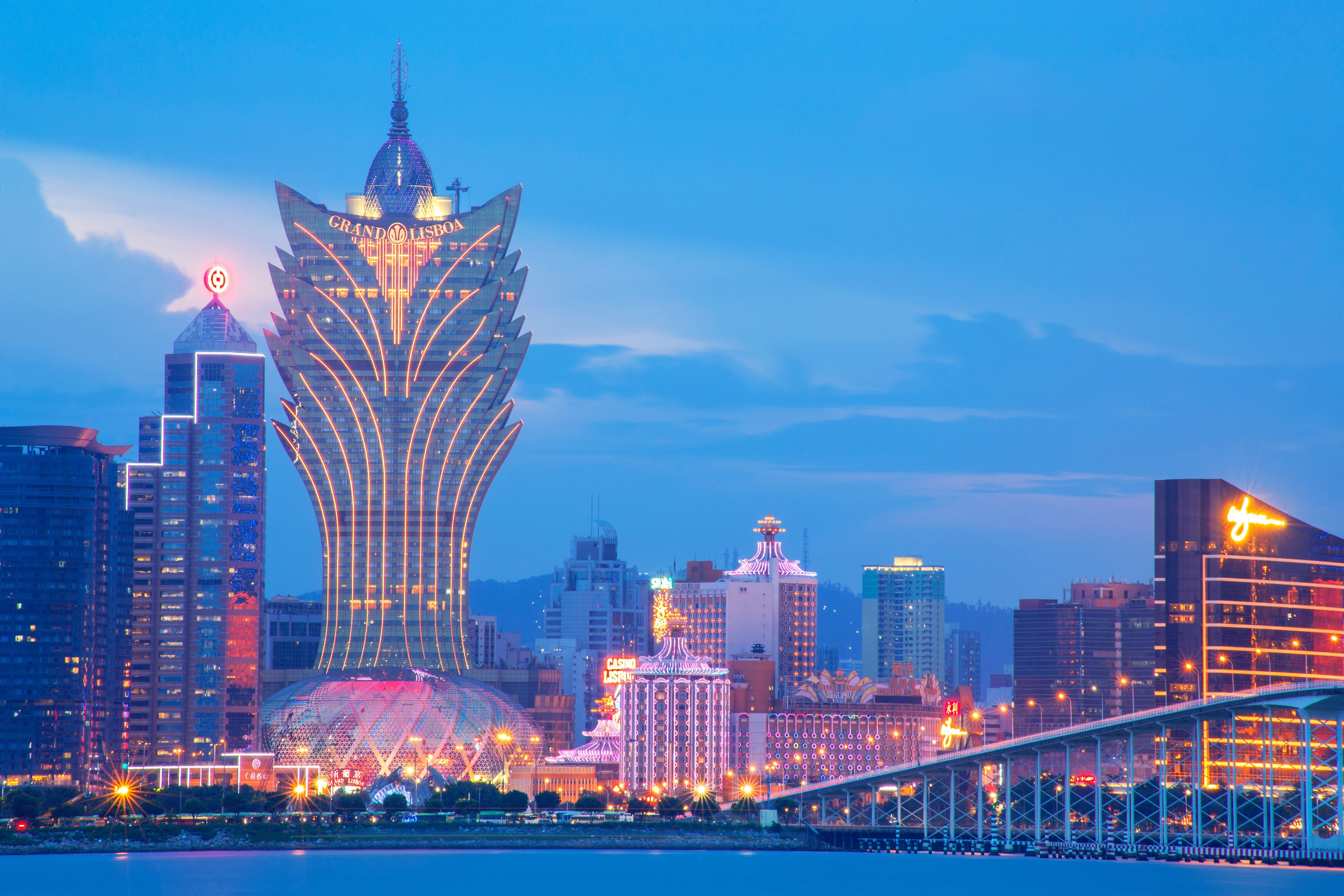 Macau cityscape with Grand Lisboa Hotel at dusk HD Wallpaper