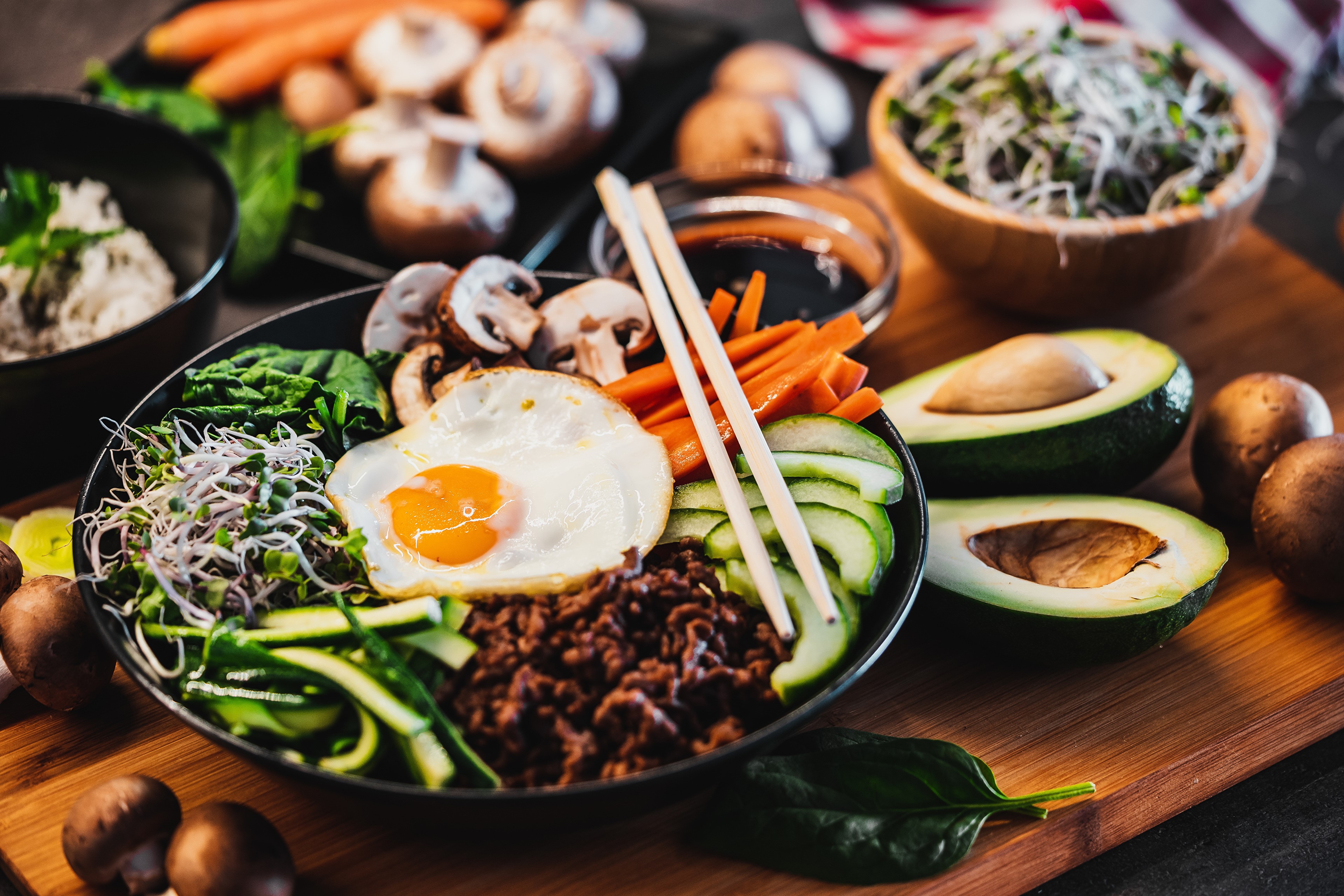 Bibimbap with Fried Egg and Chopsticks HD Wallpaper
