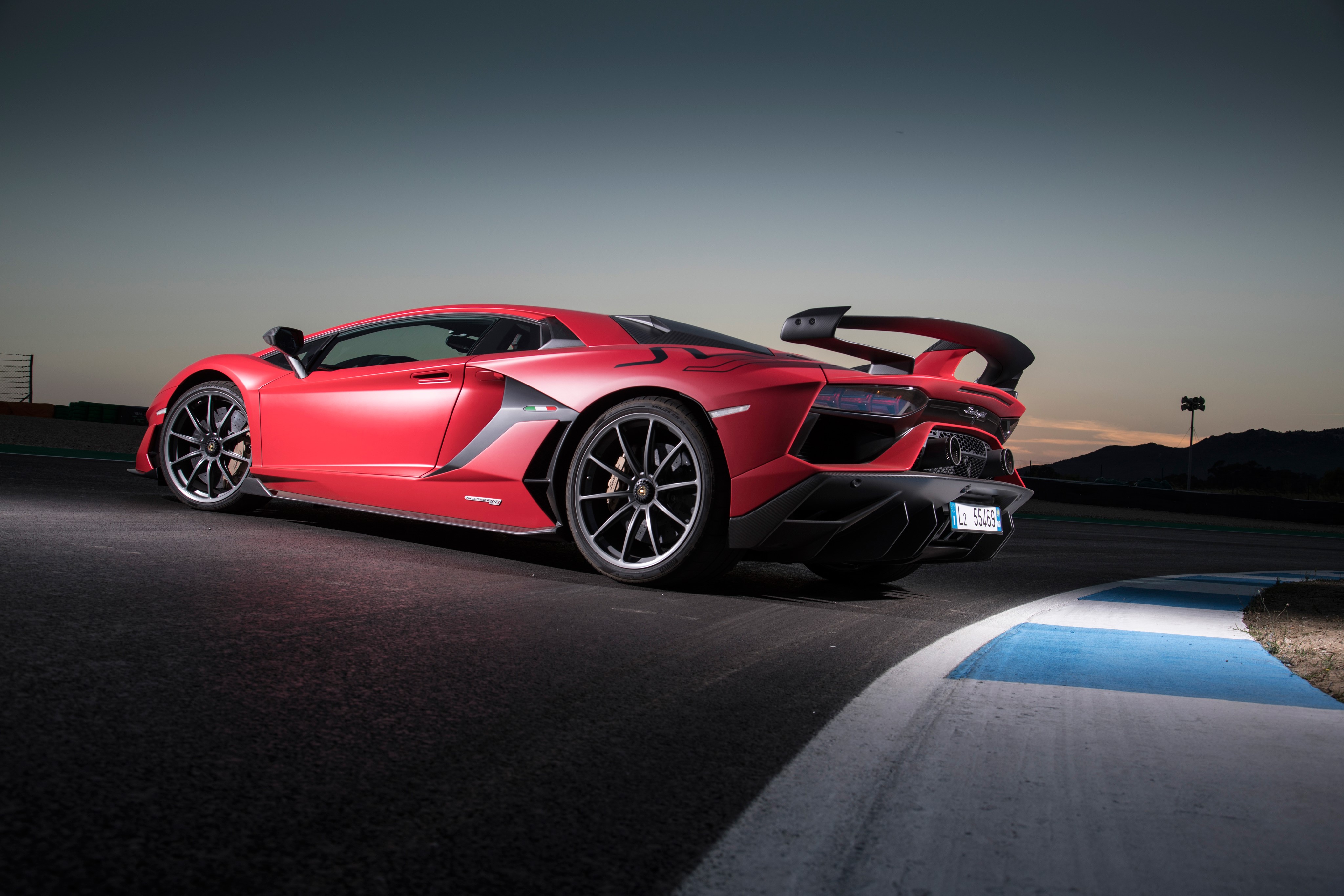 Red Lamborghini Aventador SVJ on a Racetrack HD Wallpaper