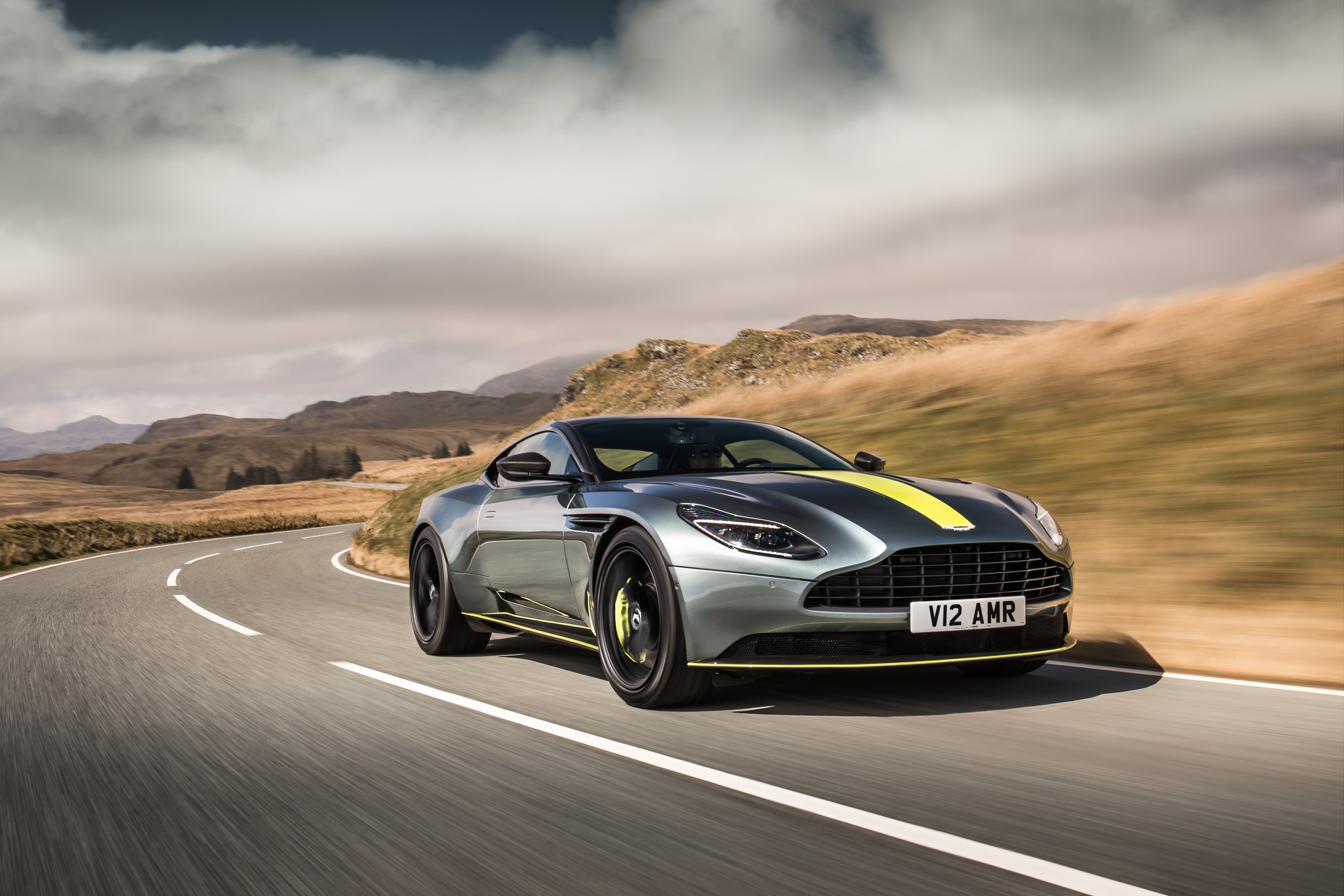 Aston Martin DB11 V12 AMR on a winding road HD Wallpaper