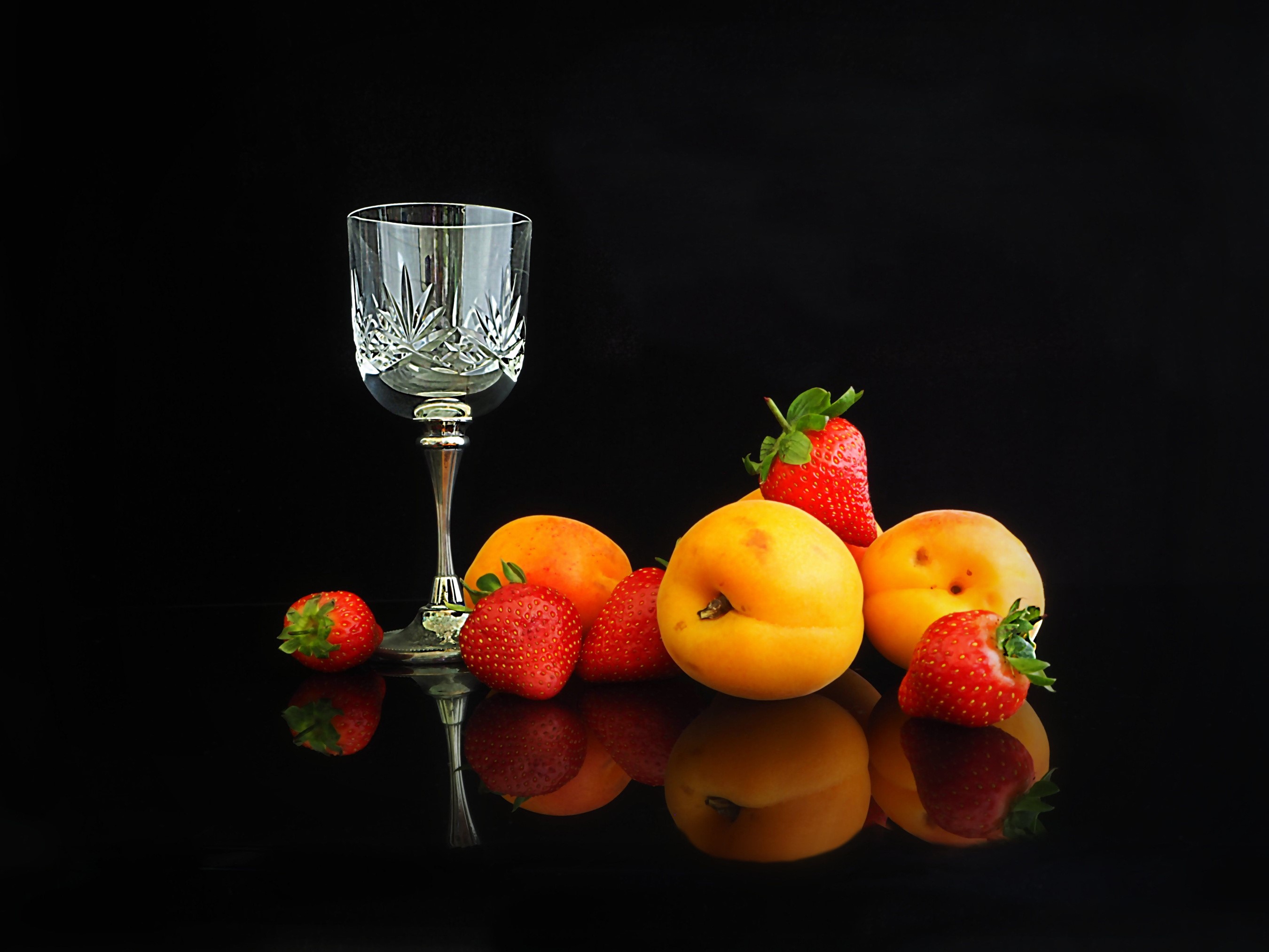 Still life of apricots and strawberries with a glass HD Wallpaper