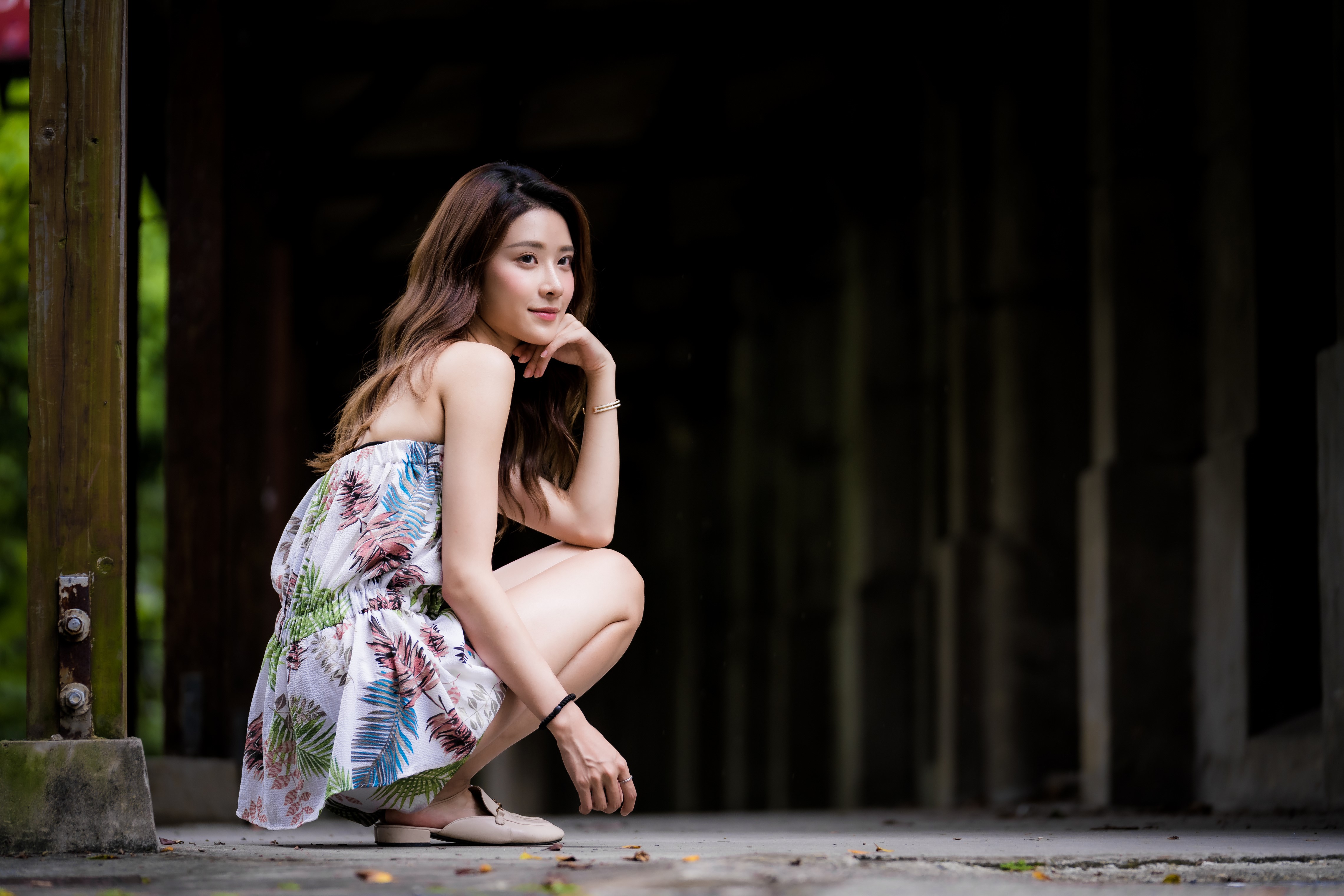4K Asian Woman Sitting with Thoughtful Glance HD Wallpaper