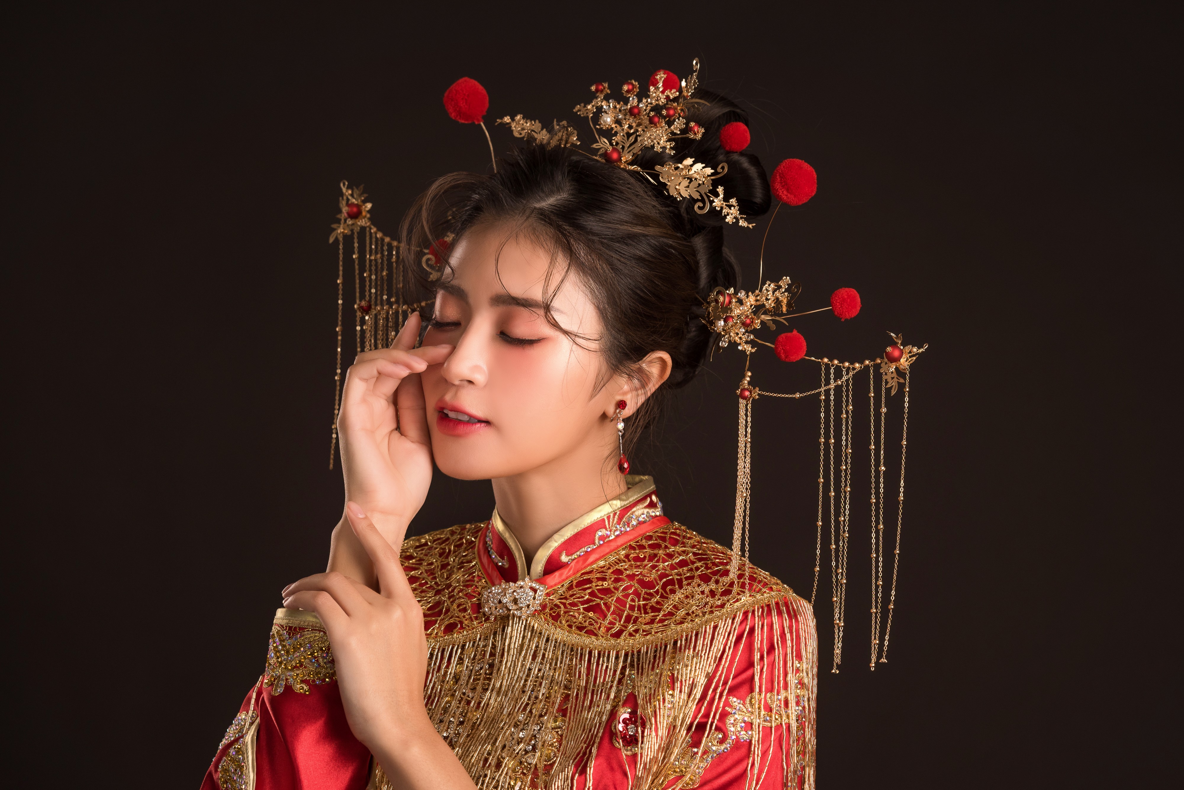 Asian woman in traditional red dress with ornate hairpiece HD Wallpaper