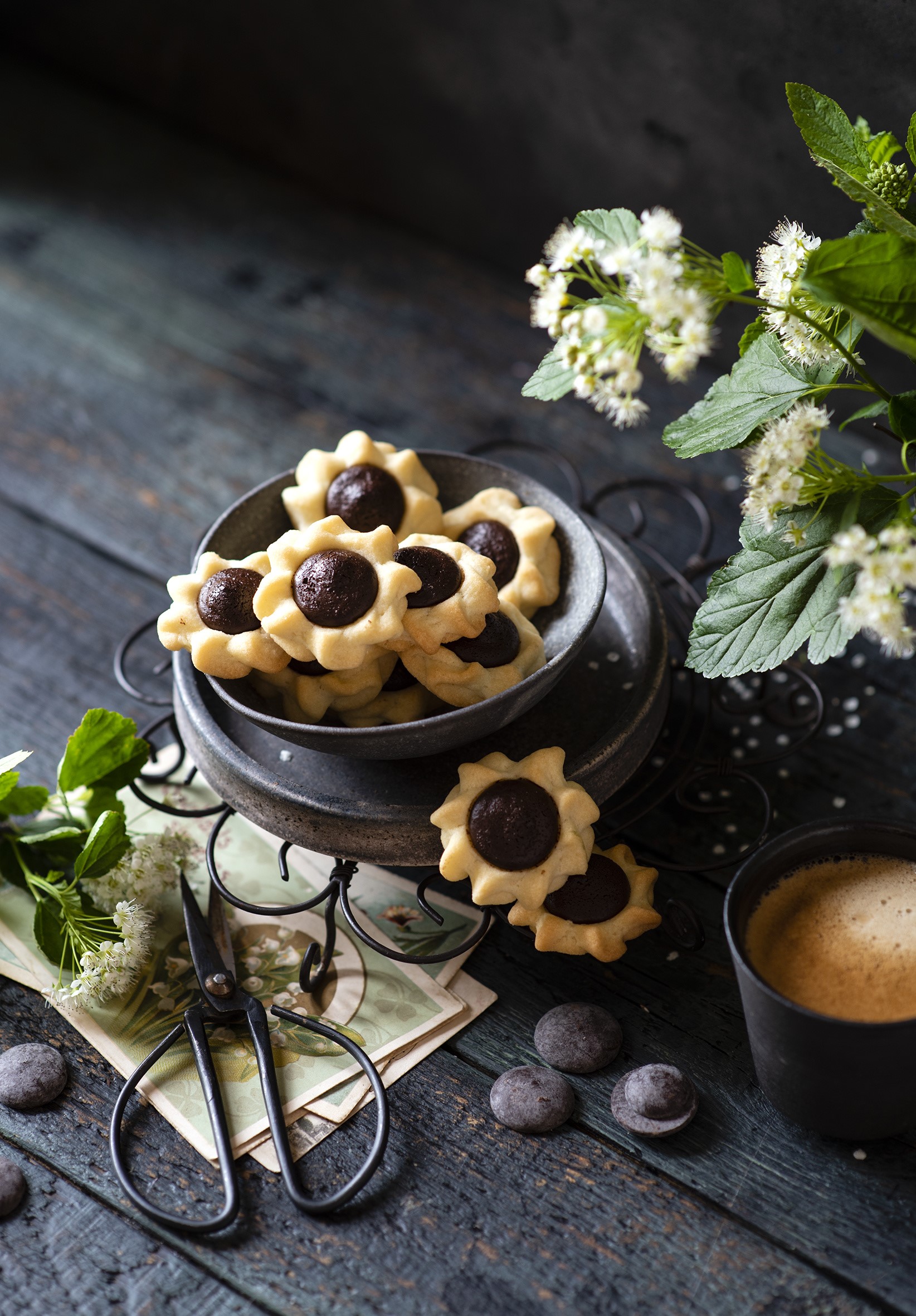Flower-shaped chocolate cookies on a dark wooden table HD Phone Wallpaper