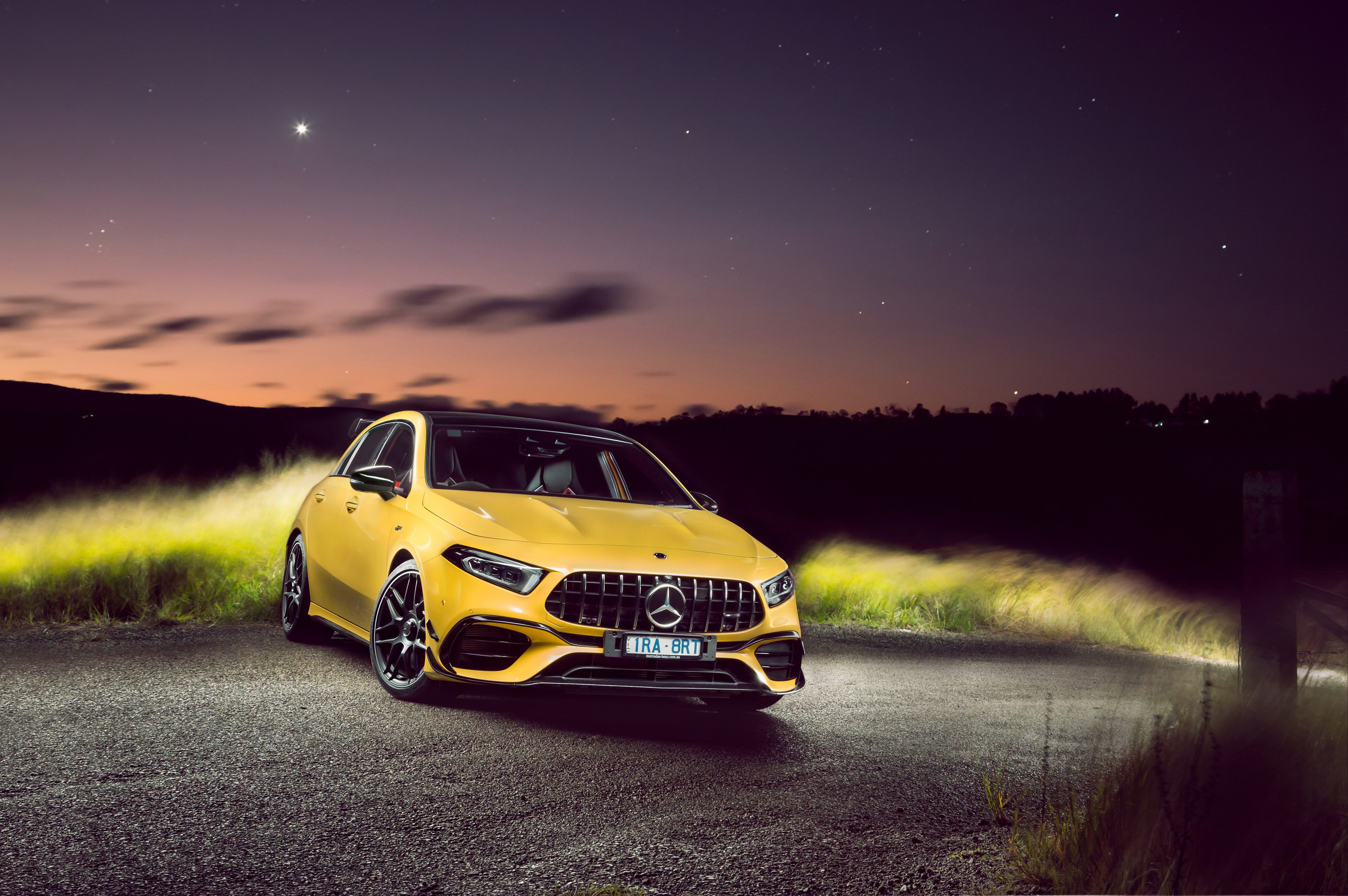 Yellow Mercedes-Benz AMG A 45 S 4MATIC Aerodynamic Package at night HD Wallpaper