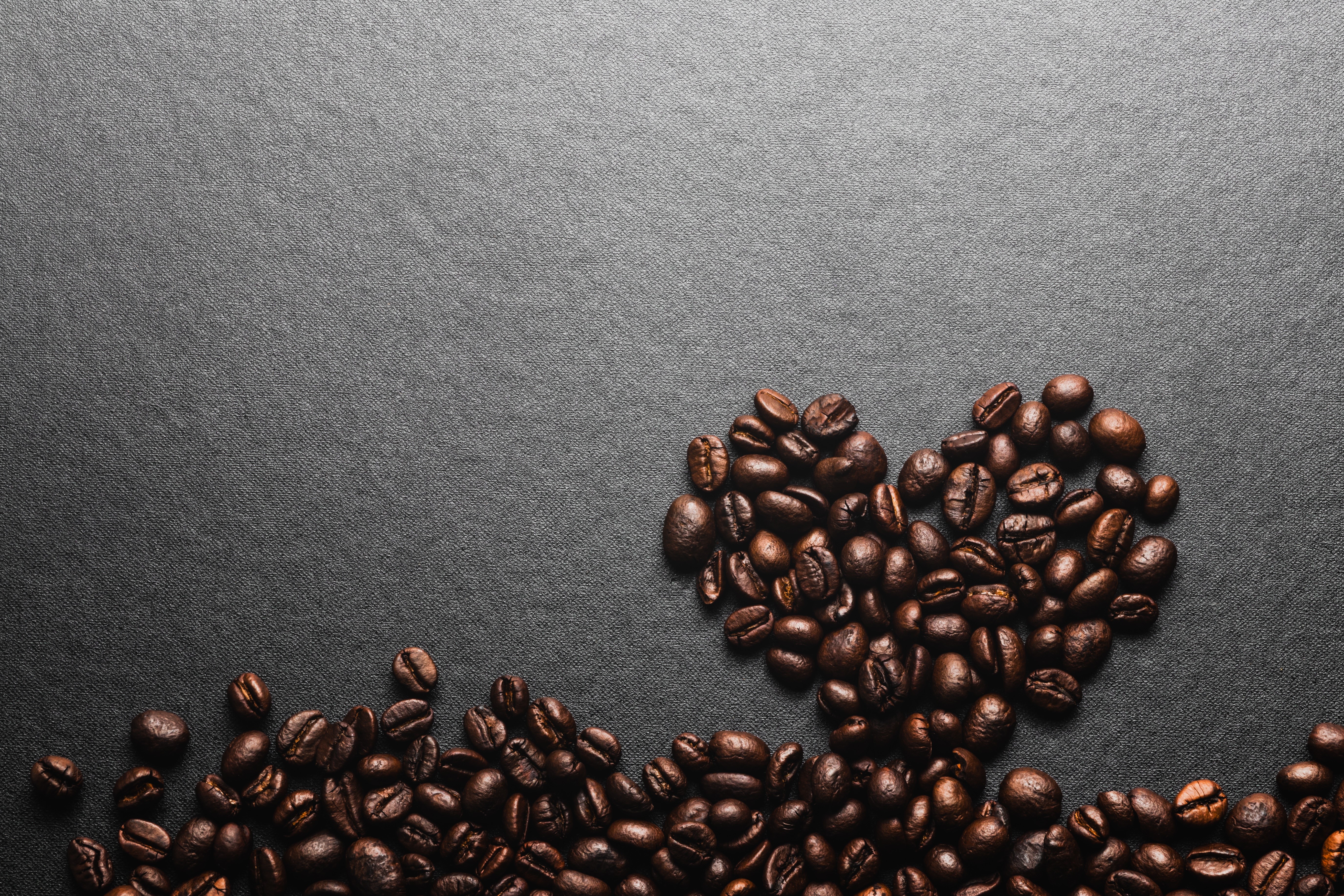 Coffee beans in a heart shape on a gray background HD Wallpaper