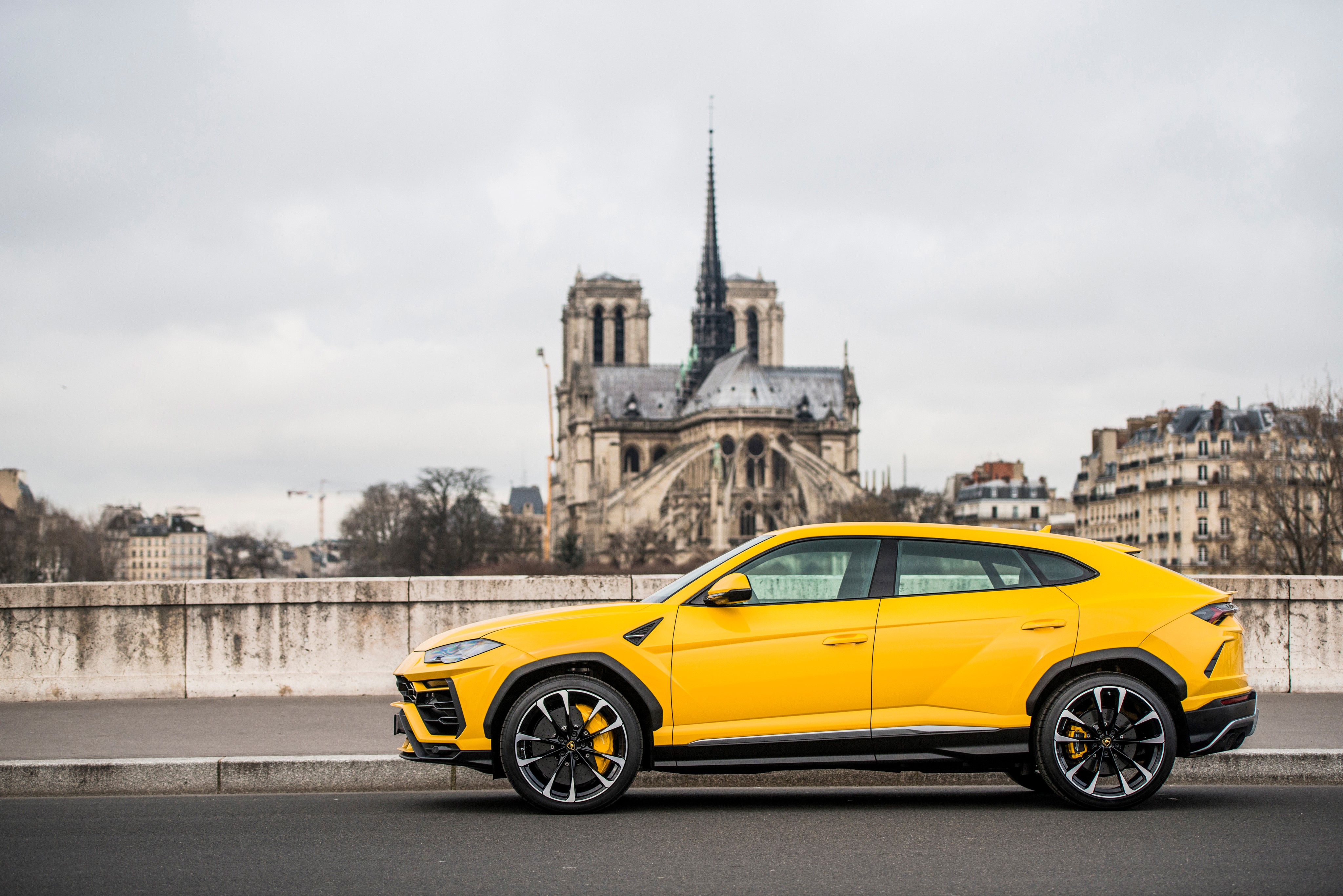 Yellow Lamborghini Urus SSUV parked in Paris HD Wallpaper