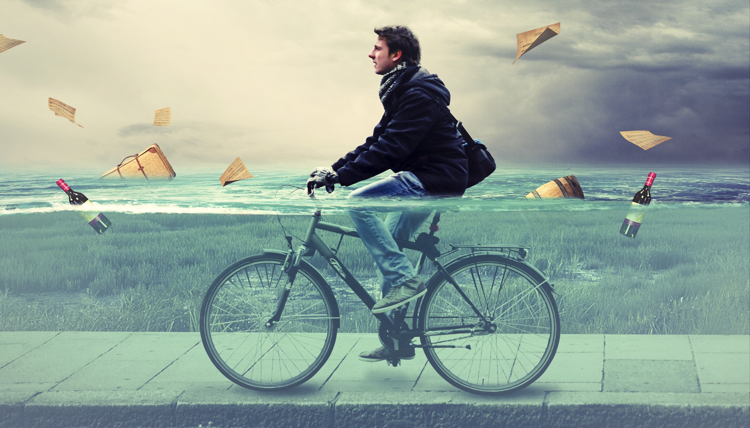 Man riding a bicycle through water with floating objects HD Wallpaper