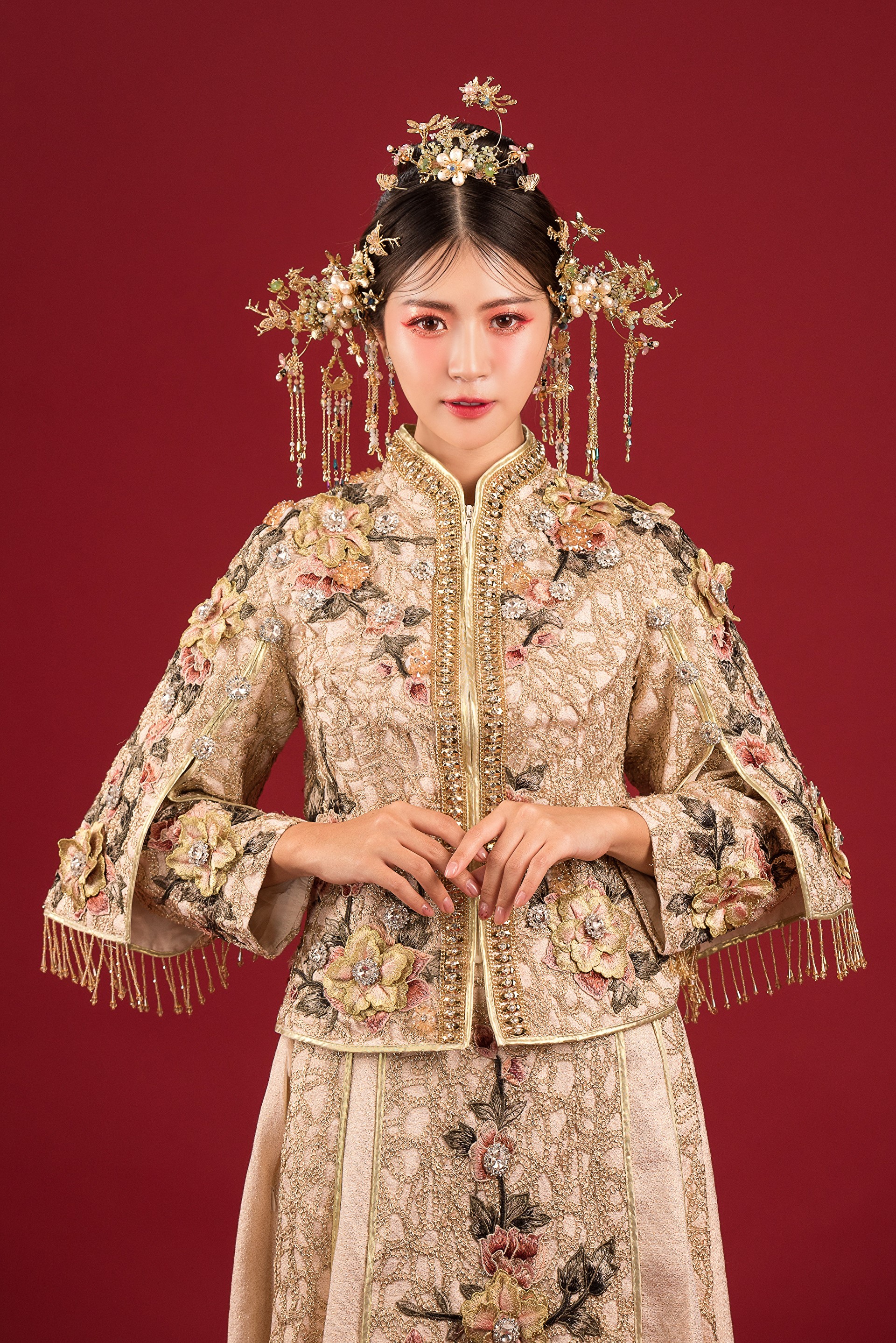 Woman in traditional Chinese wedding dress with ornate headpiece HD Phone Wallpaper