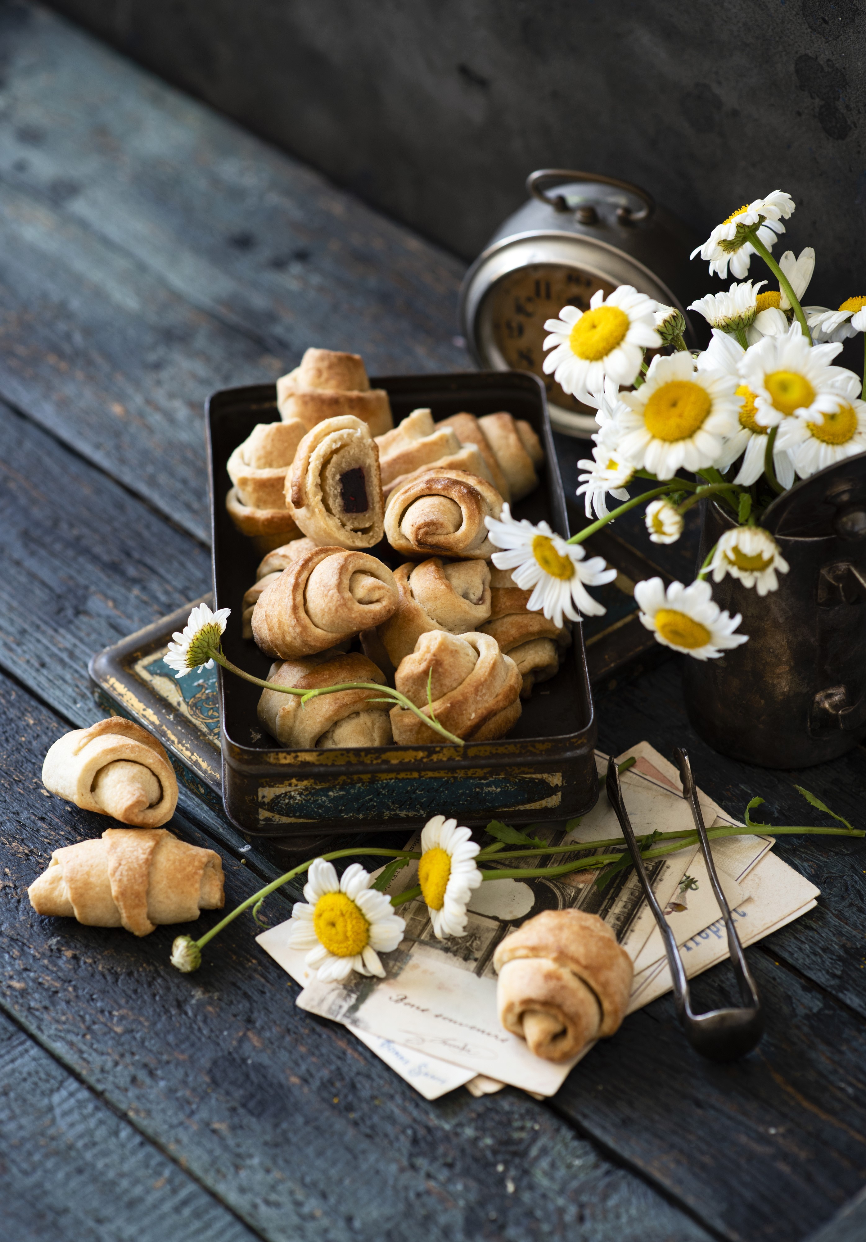 Croissants with camomiles on wooden planks HD Phone Wallpaper