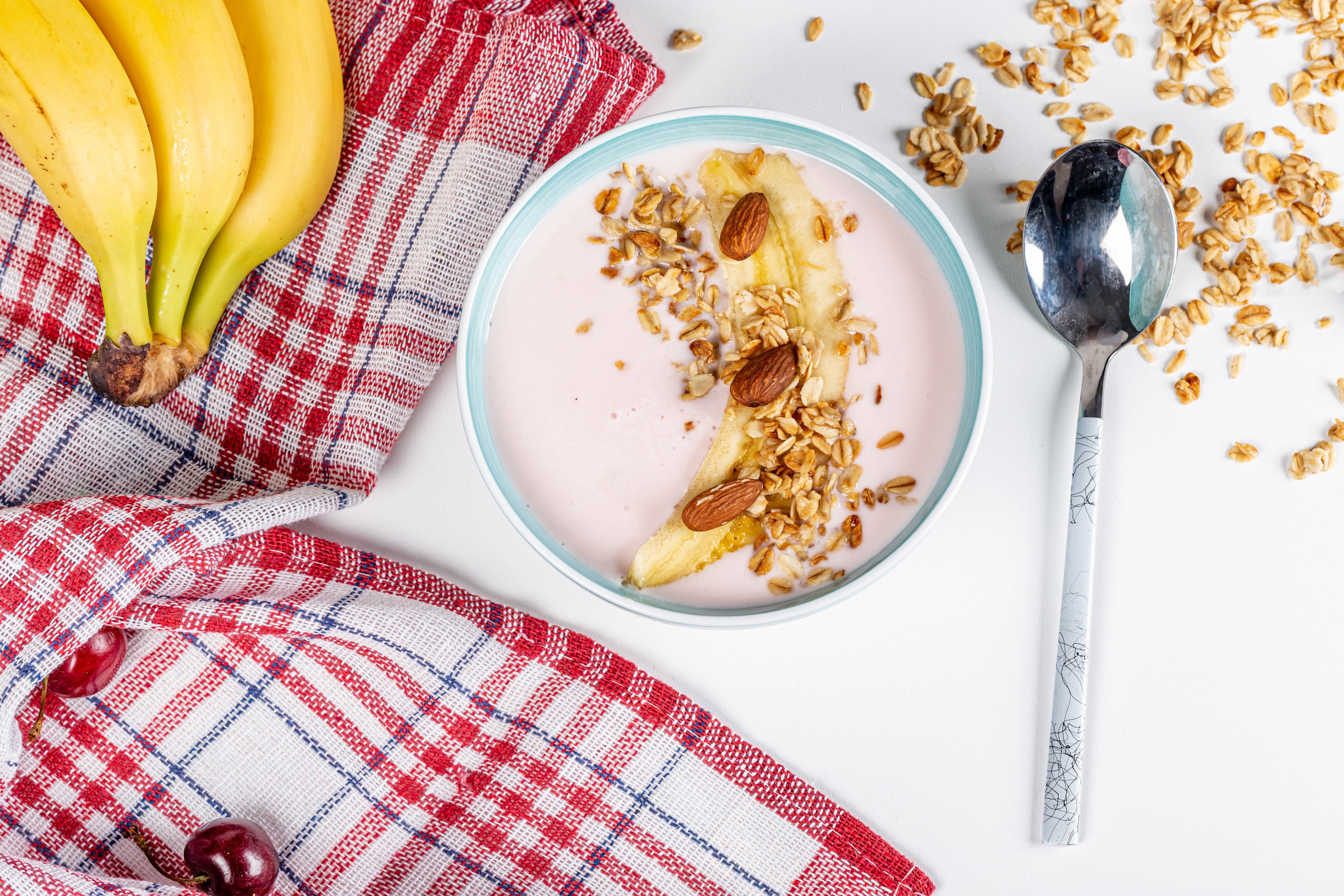 Yogurt bowl with banana, granola, and almonds HD Wallpaper