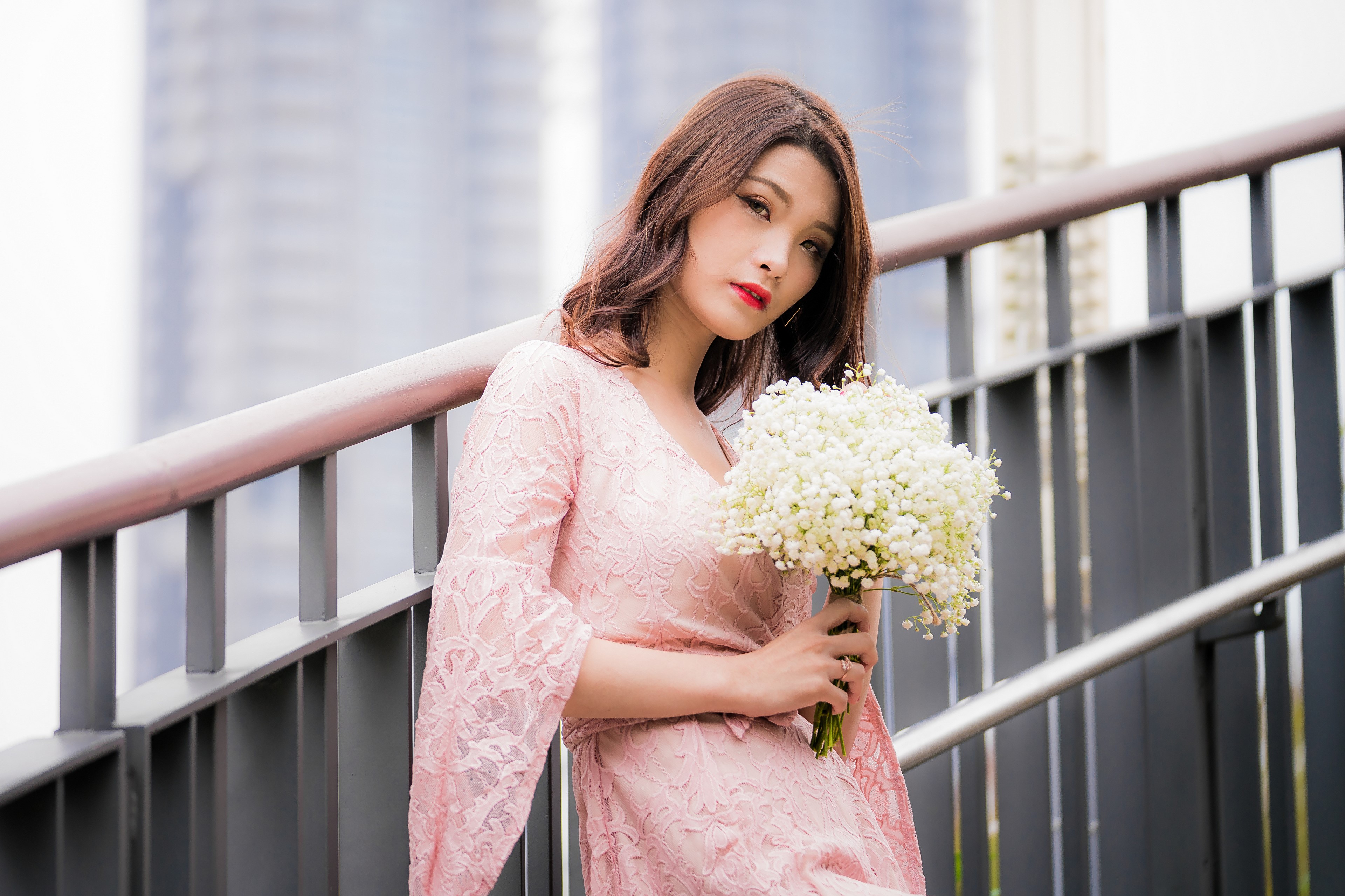 Asian woman in pink dress holding bouquet HD Wallpaper