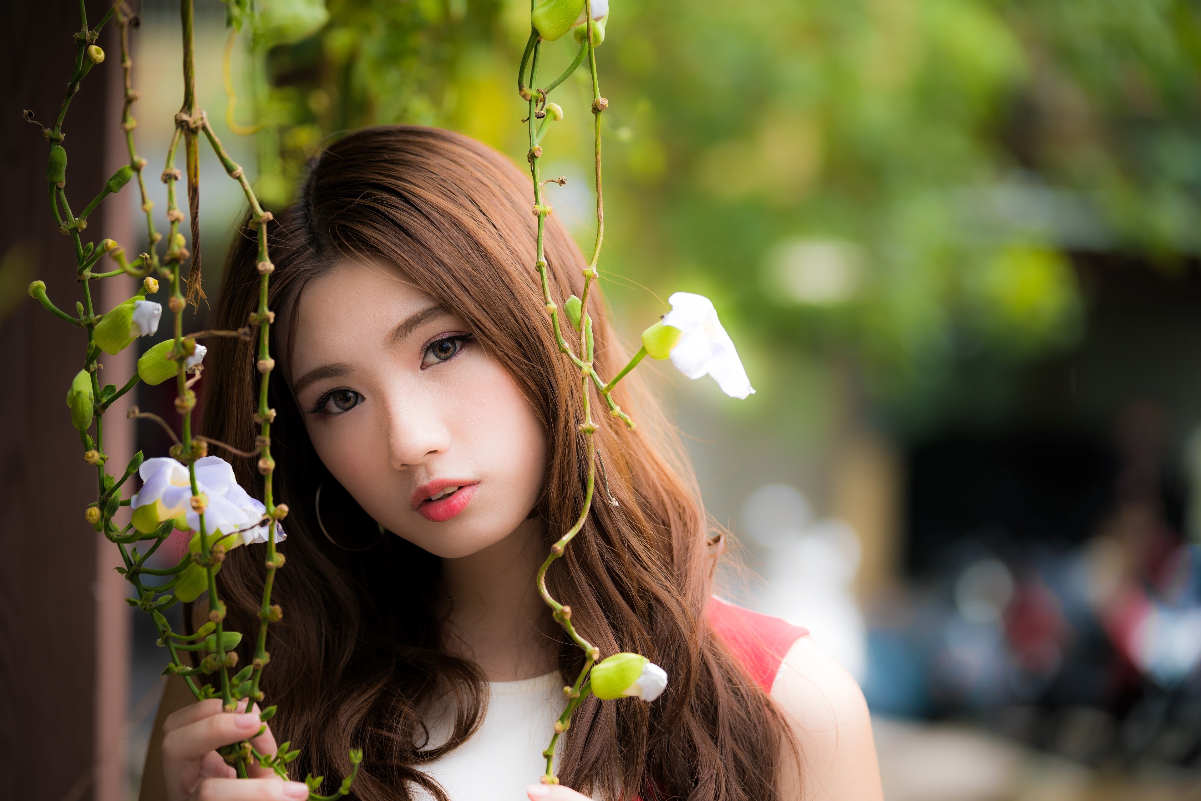 Asian woman with brown hair and flowers HD Wallpaper