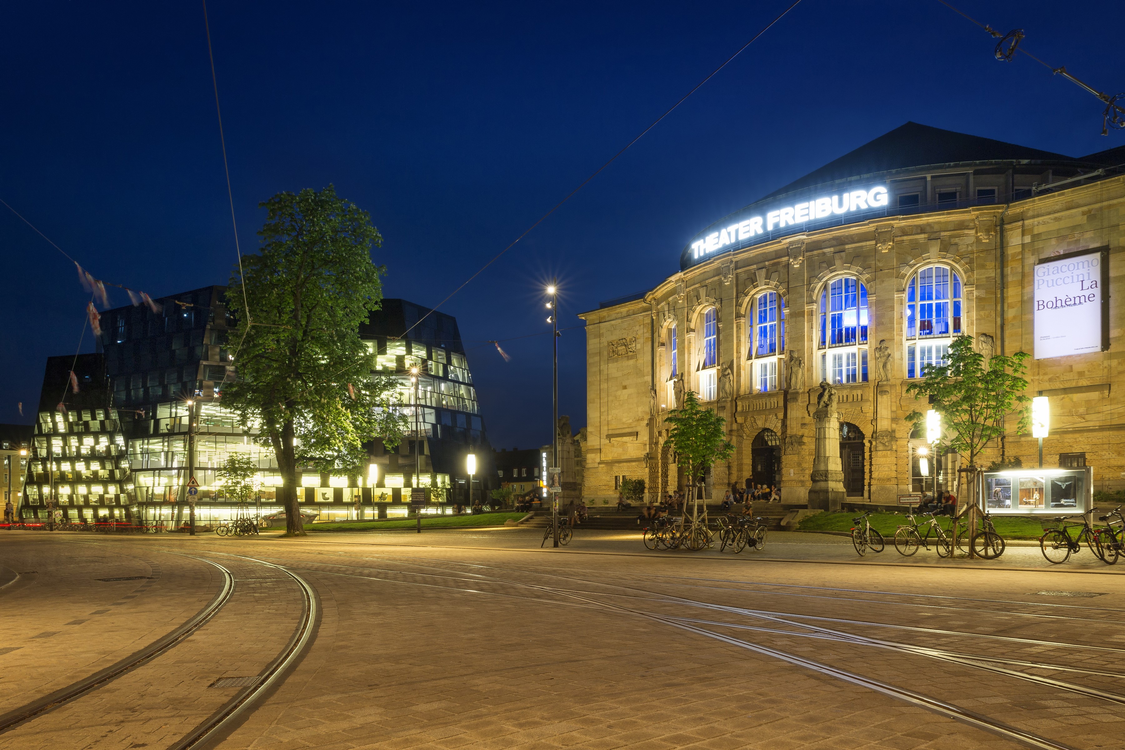 Theater Freiburg and modern building at night HD Wallpaper