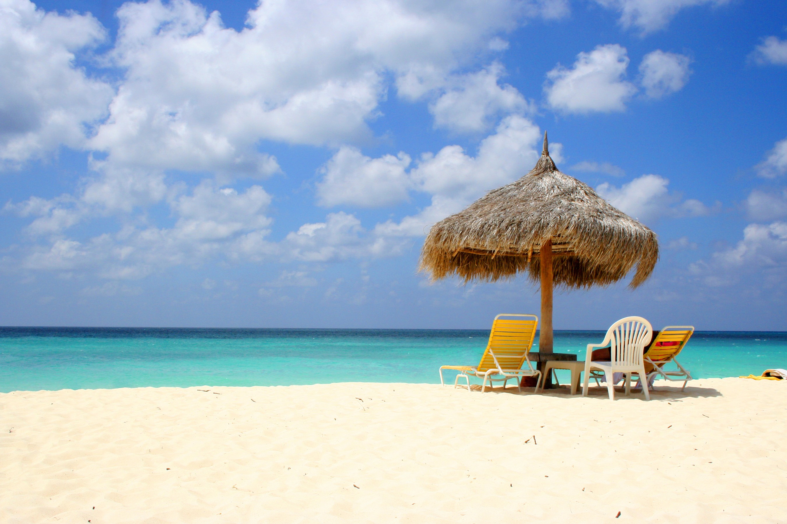 Beach with umbrella and sunloungers HD Wallpaper