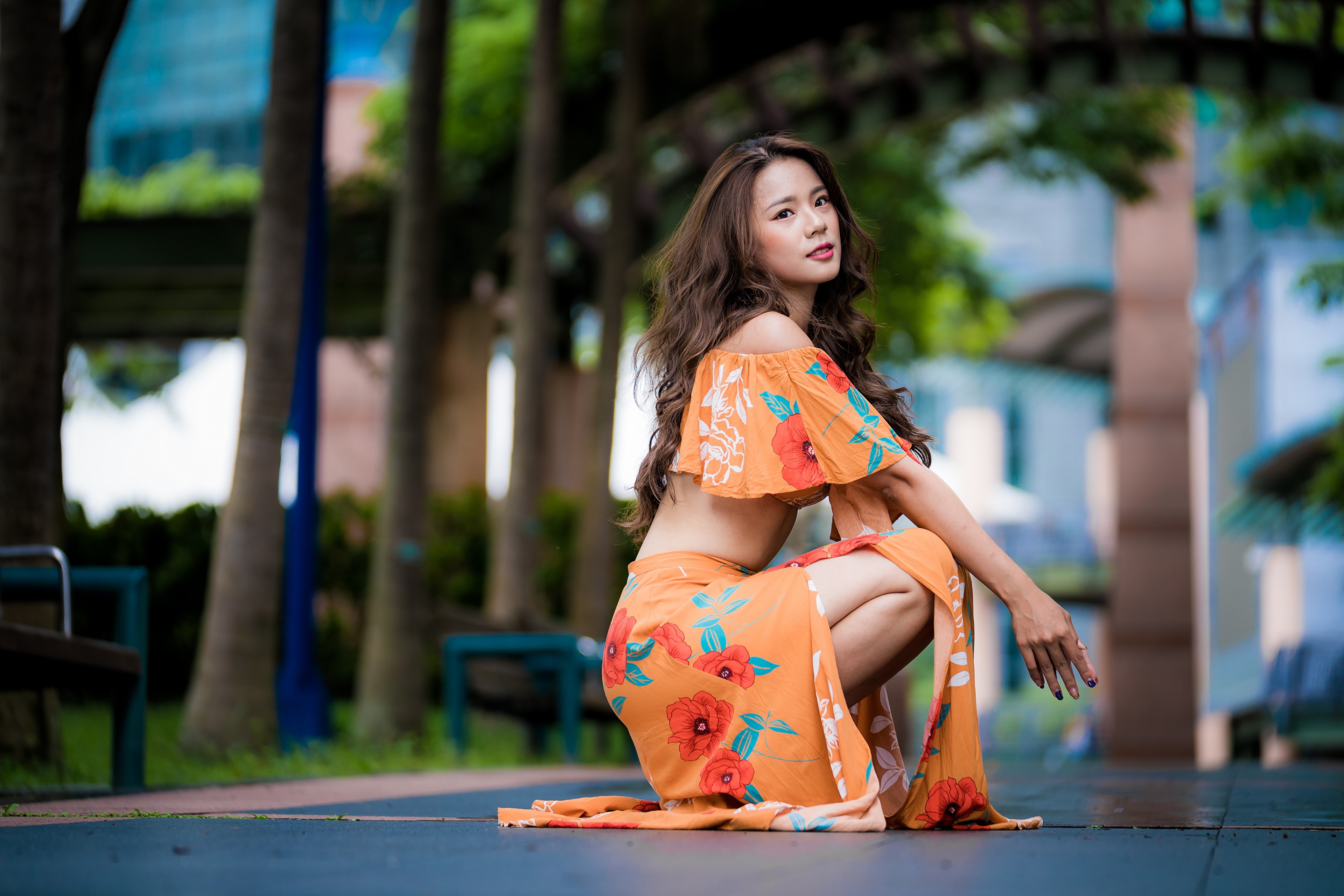 Asian woman with brown hair in orange floral dress HD Wallpaper