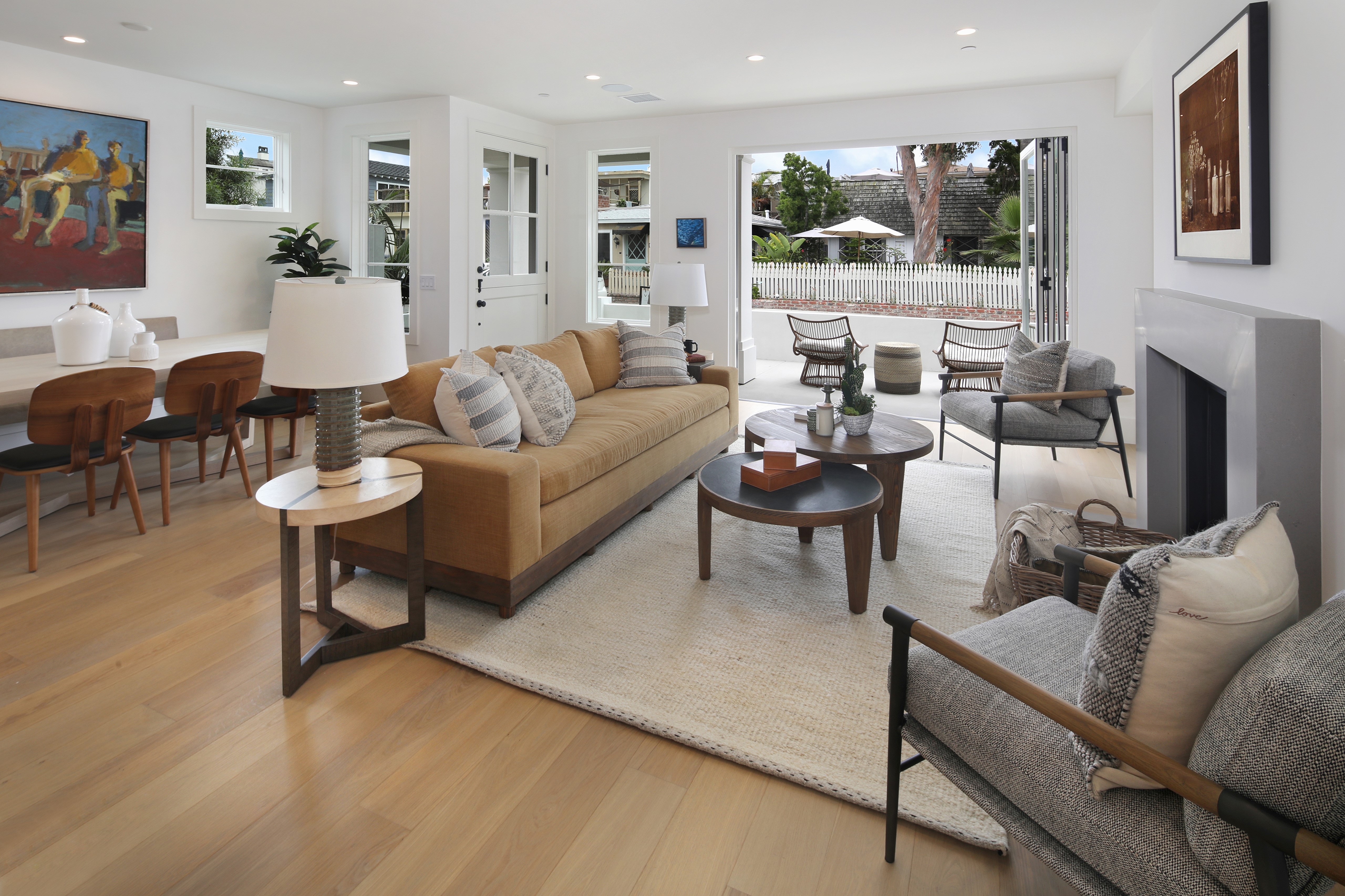 Living room with sofa, coffee tables, and fireplace HD Wallpaper