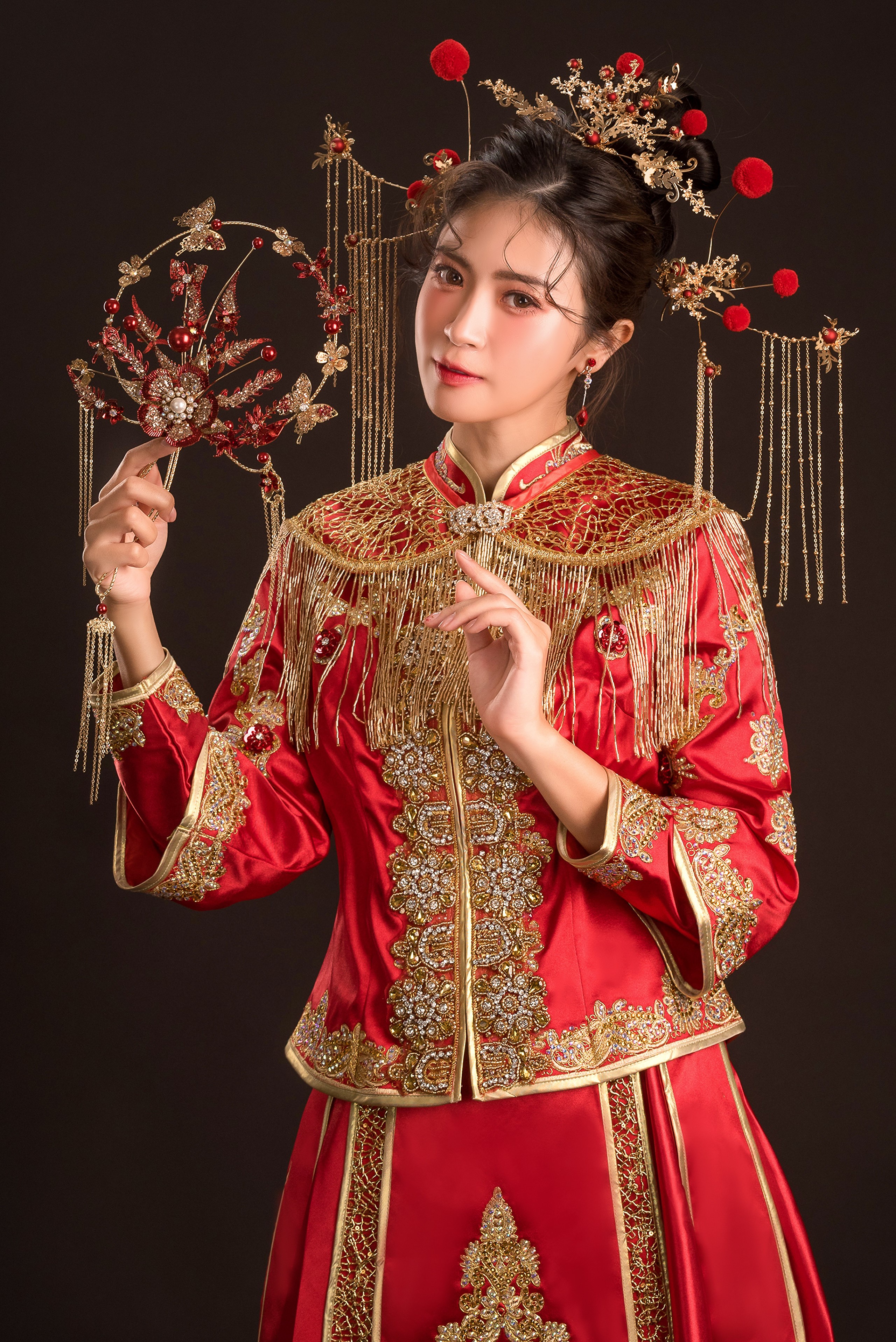 Woman in traditional Chinese wedding attire with ornate headdress HD Phone Wallpaper