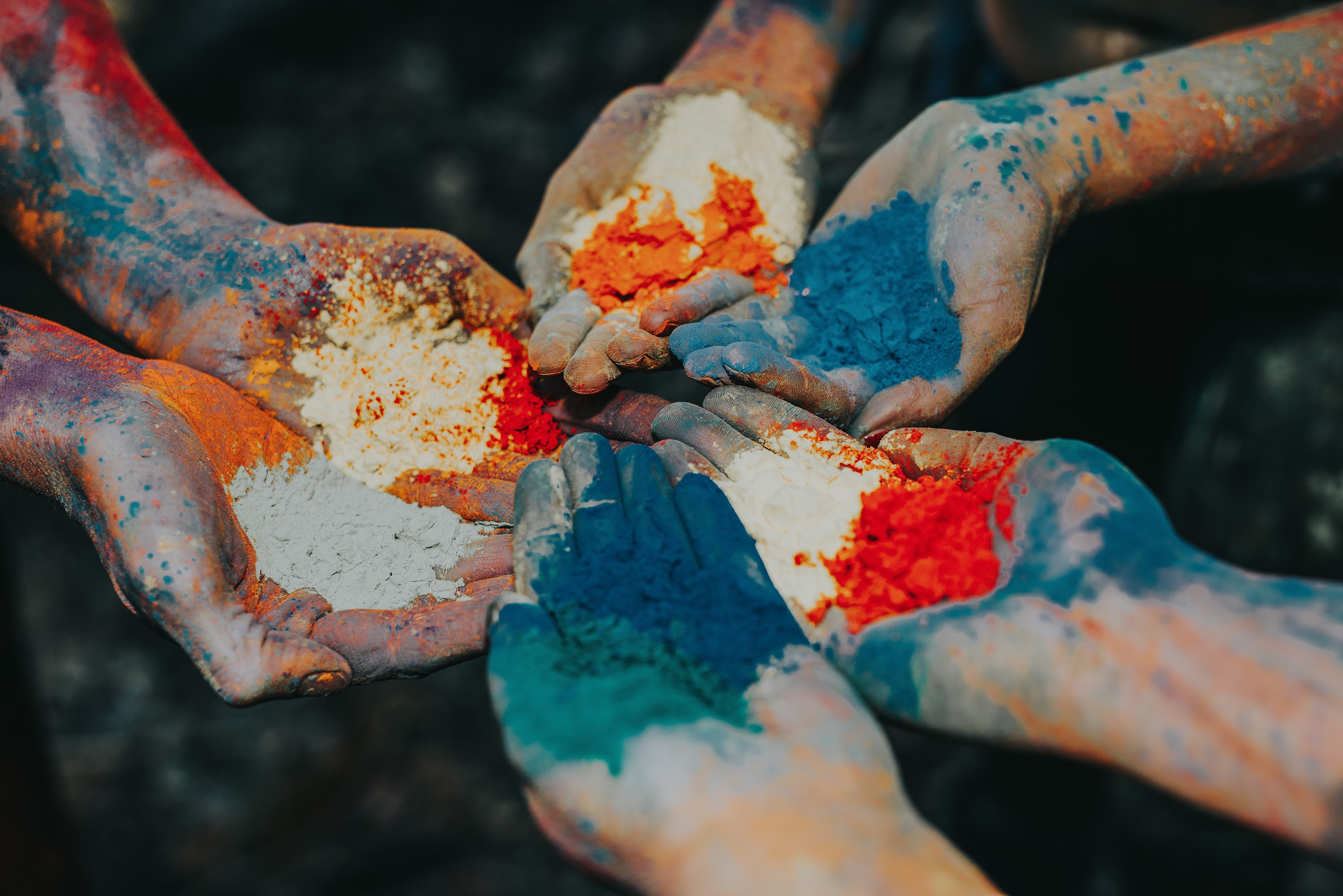 Hands covered in colorful powder HD Wallpaper