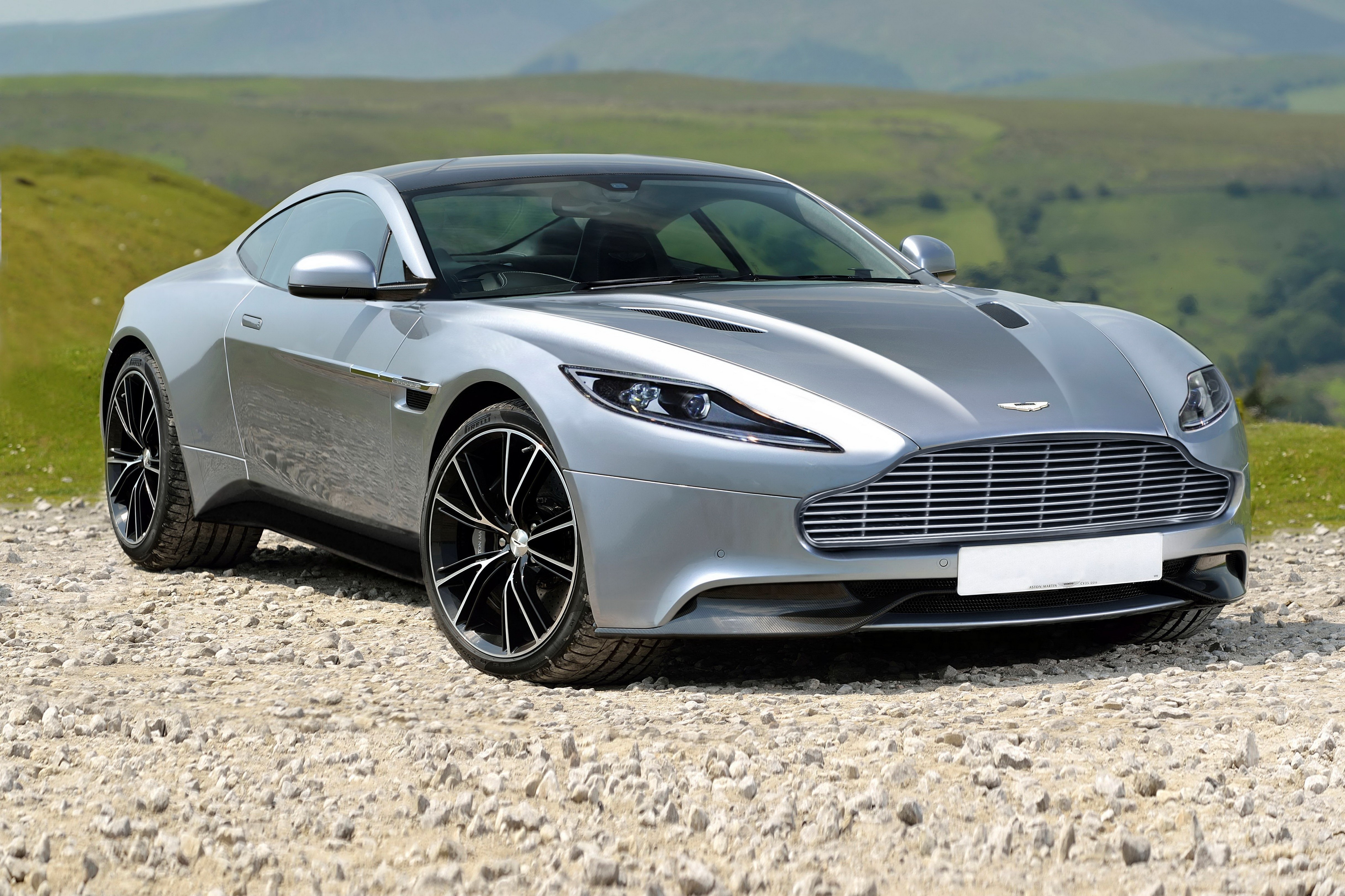 Silver Aston Martin DB9 Coupe on Gravel Road HD Wallpaper