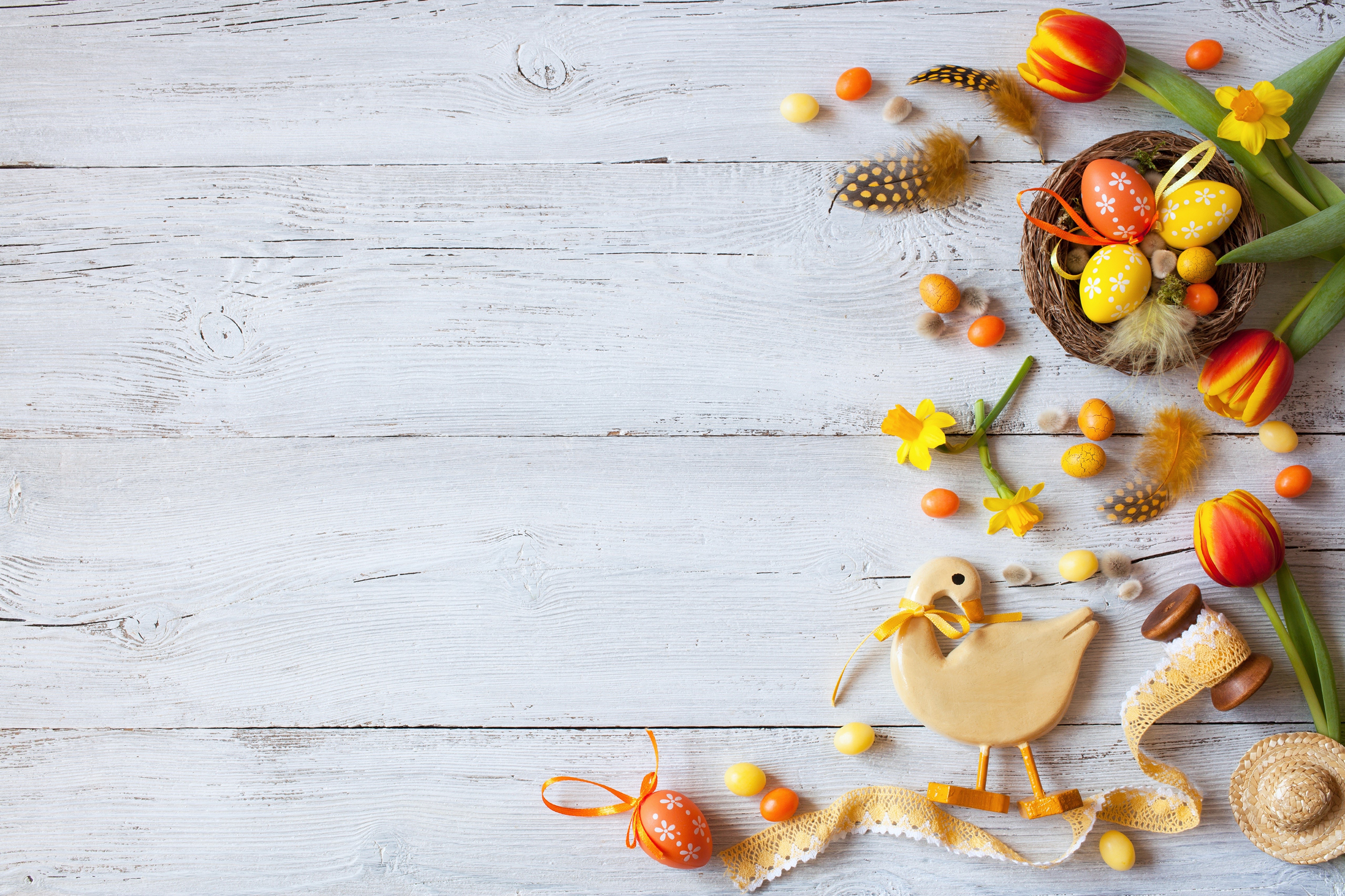 Easter decoration with tulips, eggs, and a wooden duck HD Wallpaper