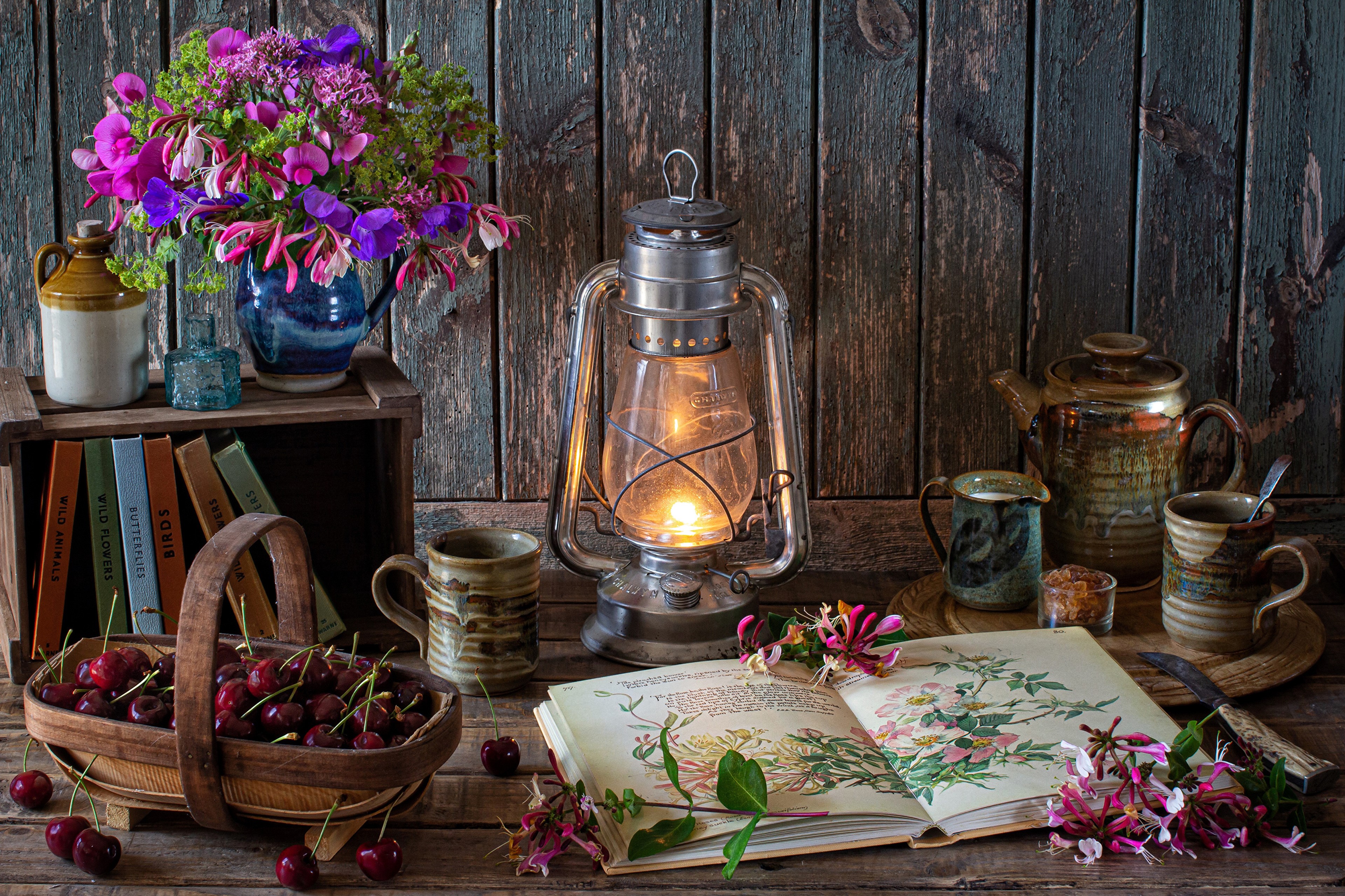 Still-life with bouquet, kerosene lamp, cherries, books, and pottery HD Wallpaper