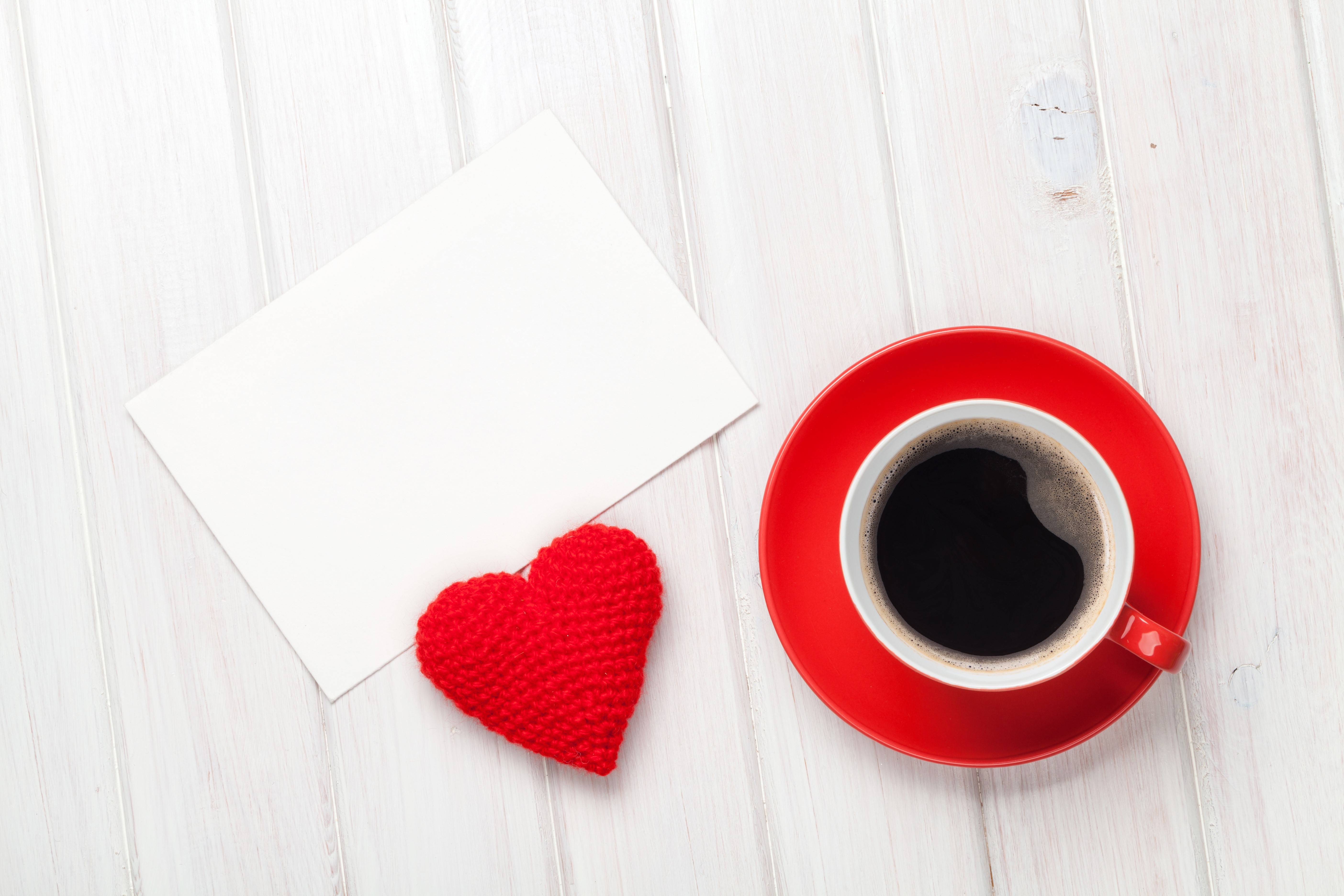 Coffee cup, red heart, and blank card on wooden table HD Wallpaper