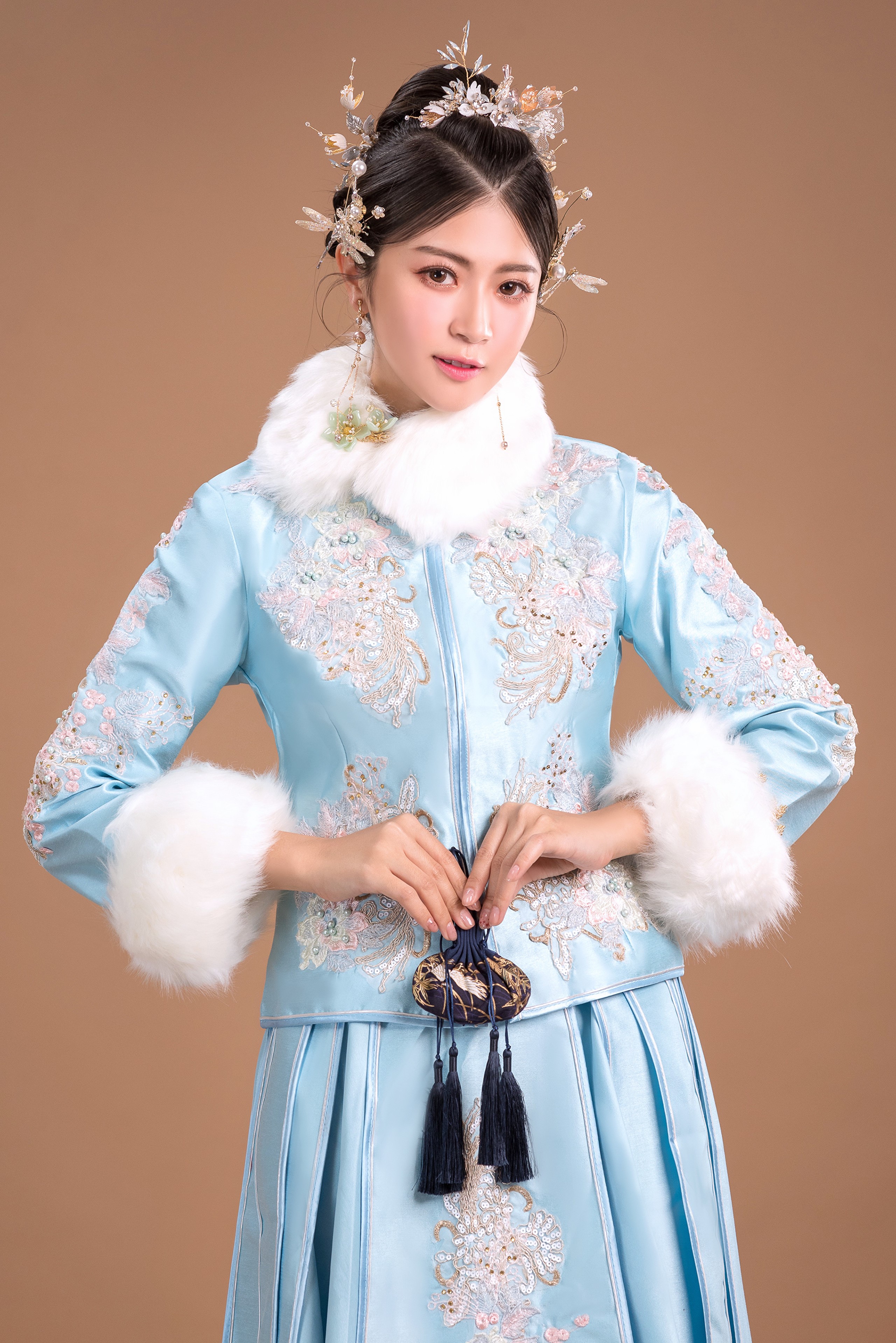 Woman in traditional blue embroidered coat with fur trim HD Phone Wallpaper