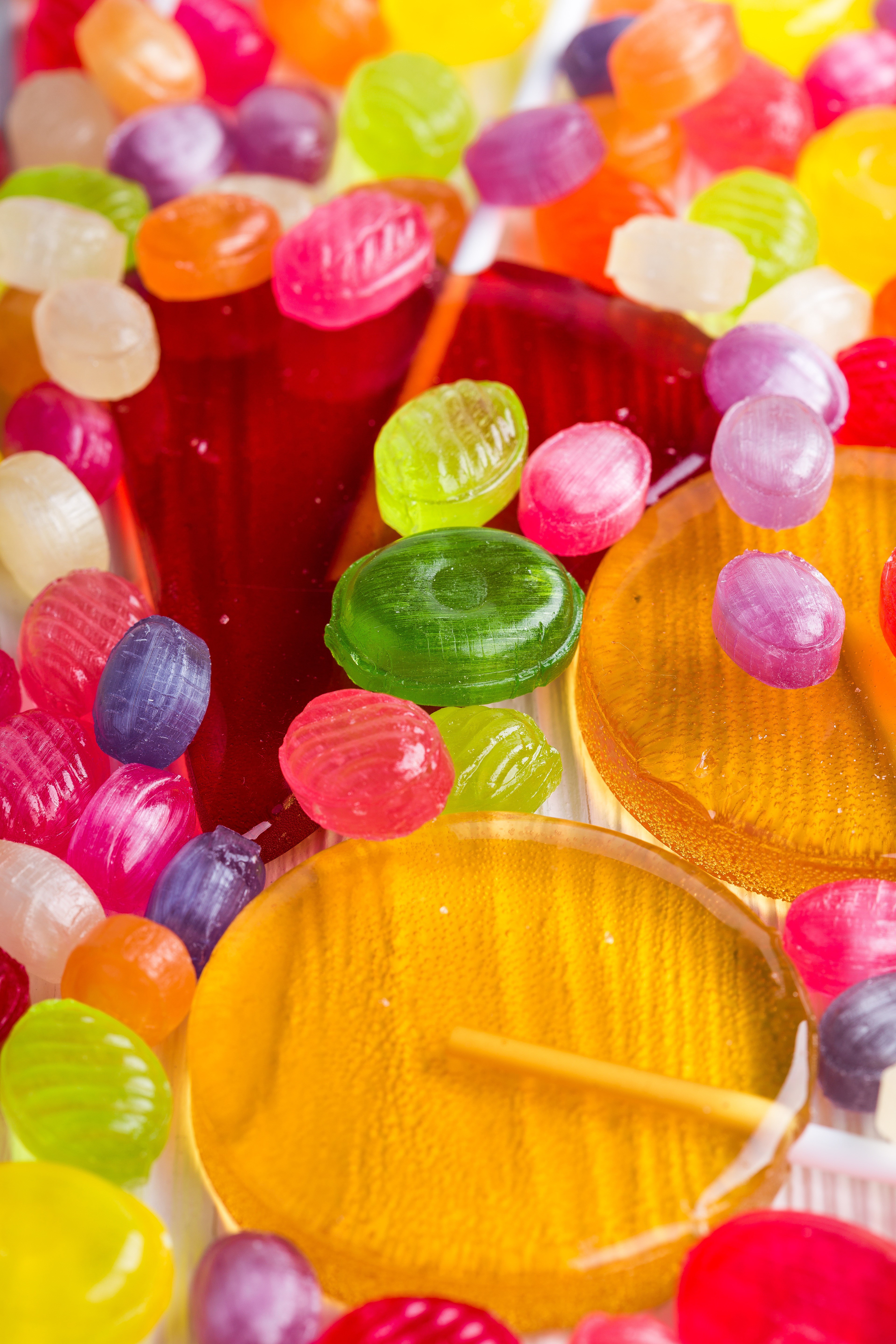 4K Multicolor Candies and Lollipops HD Phone Wallpaper