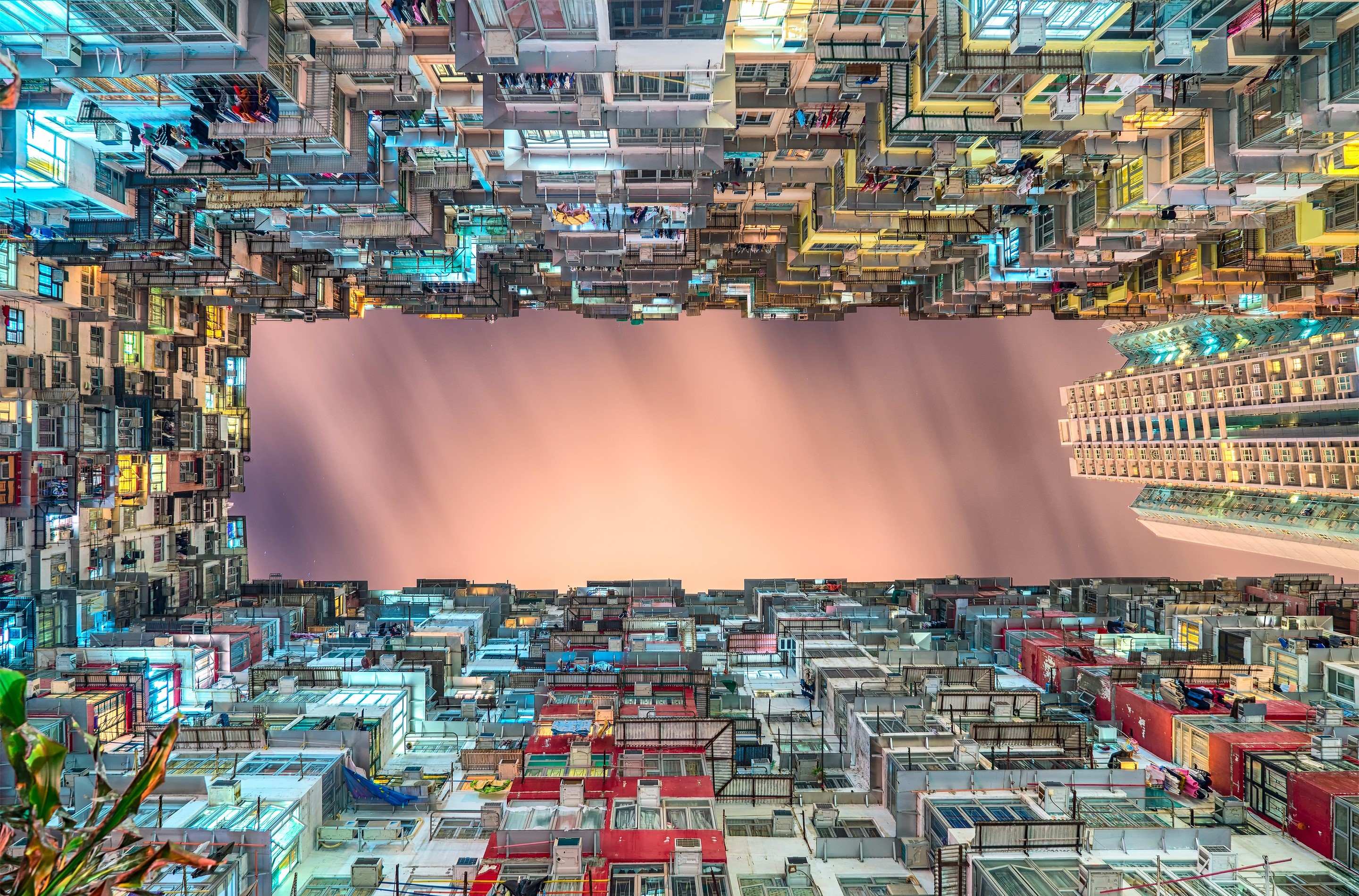 Hong Kong apartment buildings at dusk, bottom view HD Wallpaper