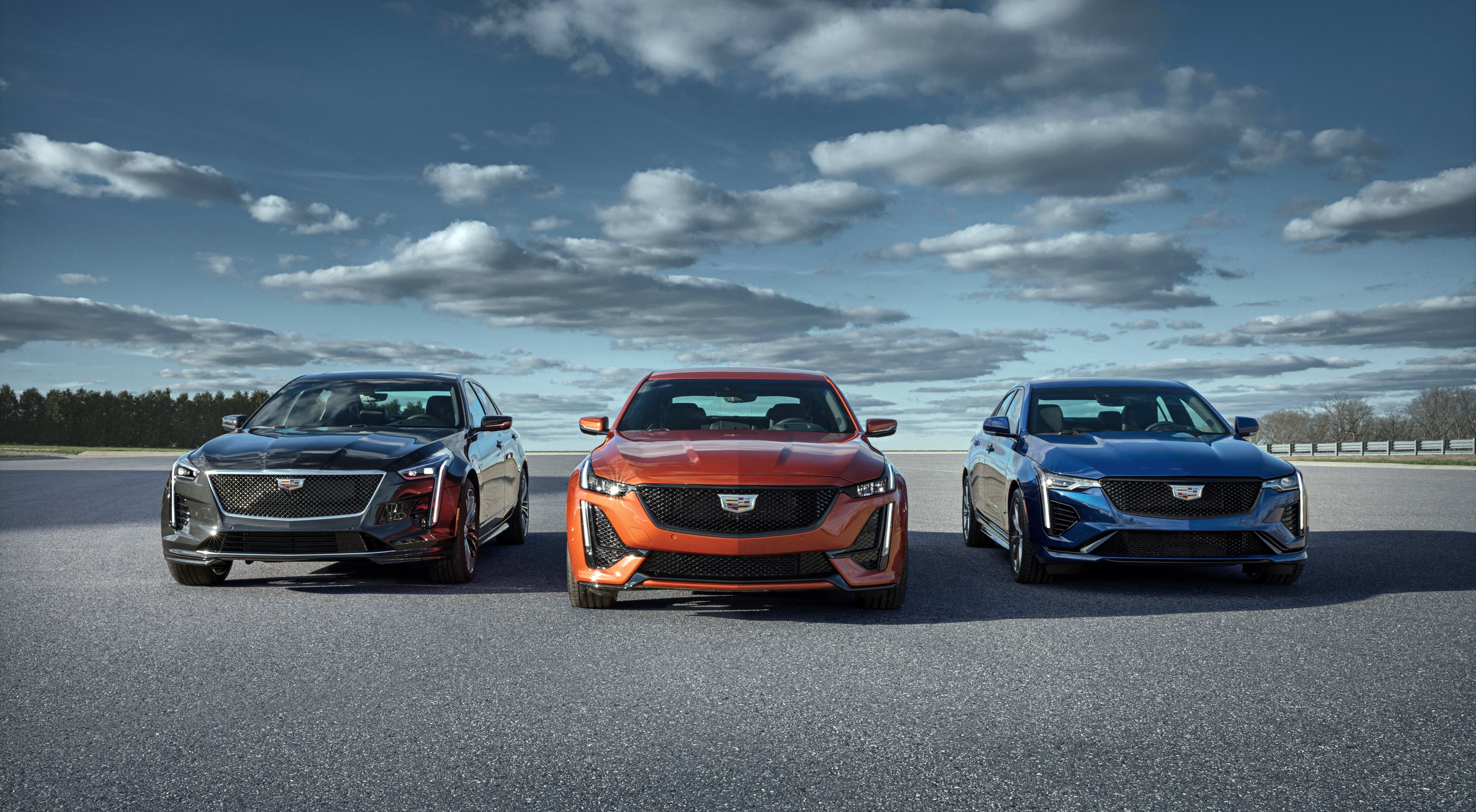 Three Cadillacs CT4-V Sedans on Asphalt HD Wallpaper