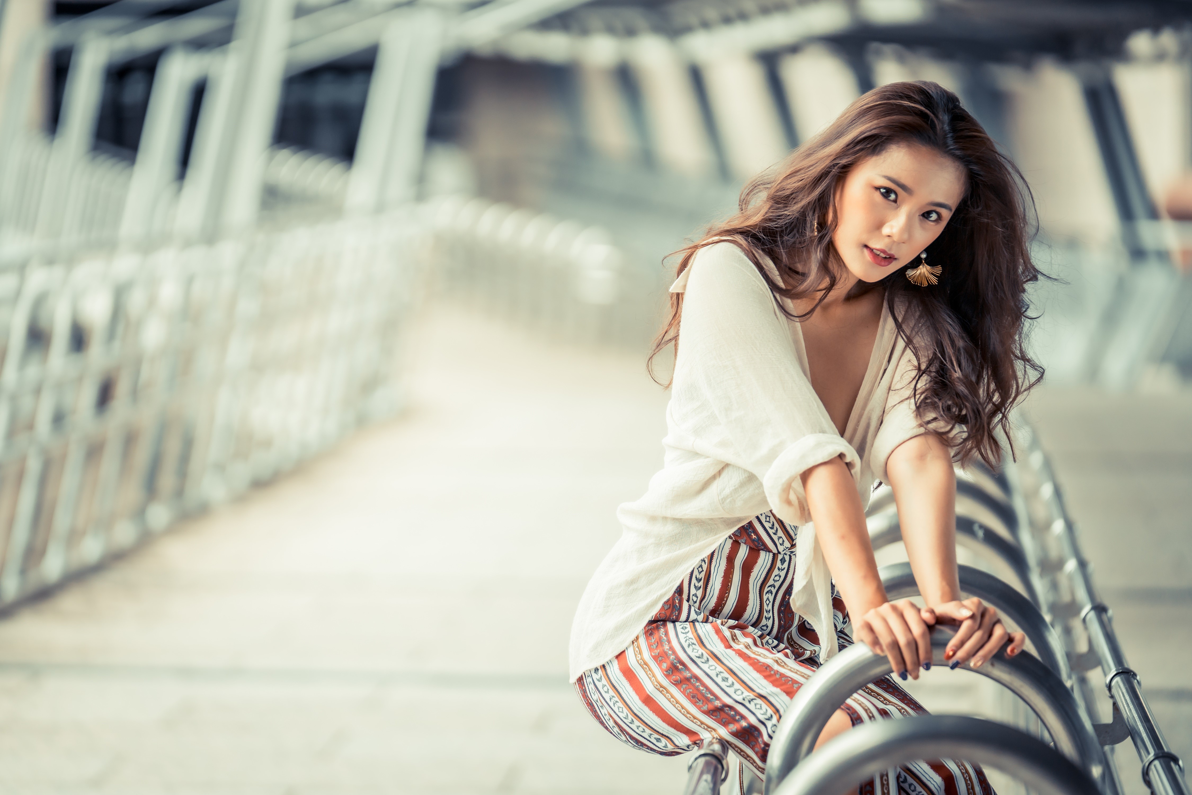Asian woman with brown hair posing on a bridge HD Wallpaper